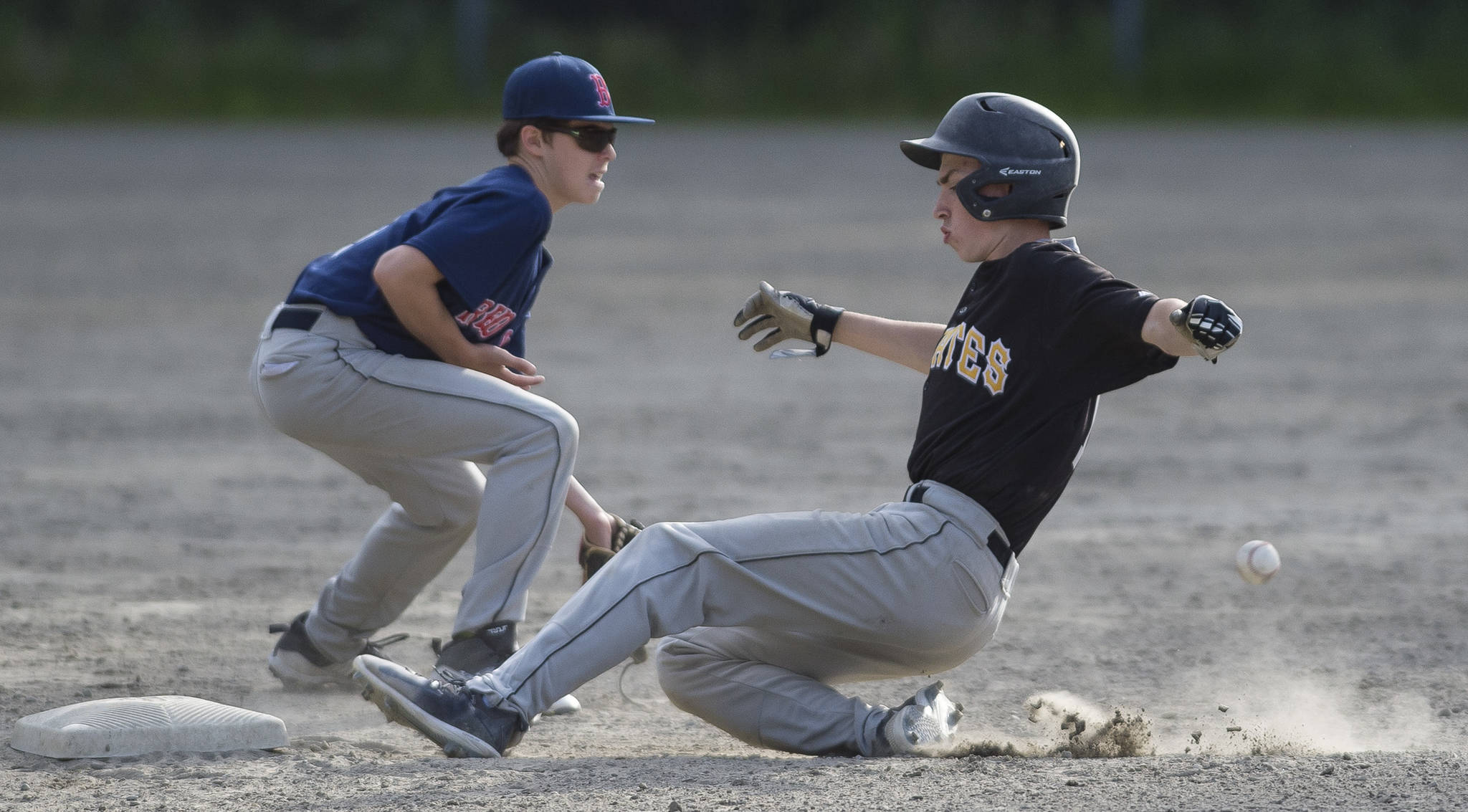 Pirates’ Josh Carte steals second base as Red Sox’s Caden Mesdag fields the throw from home in the third inning at the Gastineau Channel Little League Junior Division Championship game at Adair-Kennedy Memorial Park on Friday. The Pirates won 8-6. (Michael Penn | Juneau Empire)