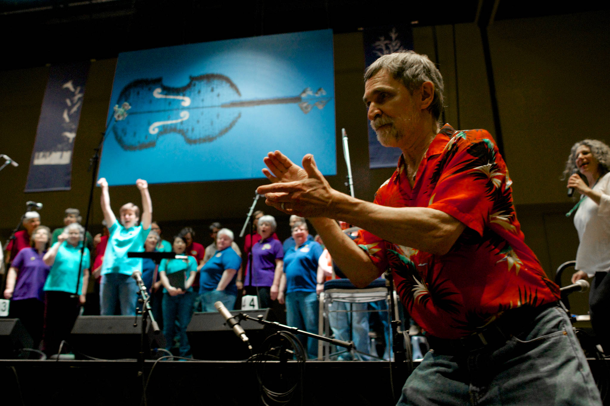 KTOO’s Jeff Brown whips up the audience for the start of the 41st Annual Alaska Folk Festival at Centennial Hall on Monday. (Michael Penn | Juneau Empire File)
