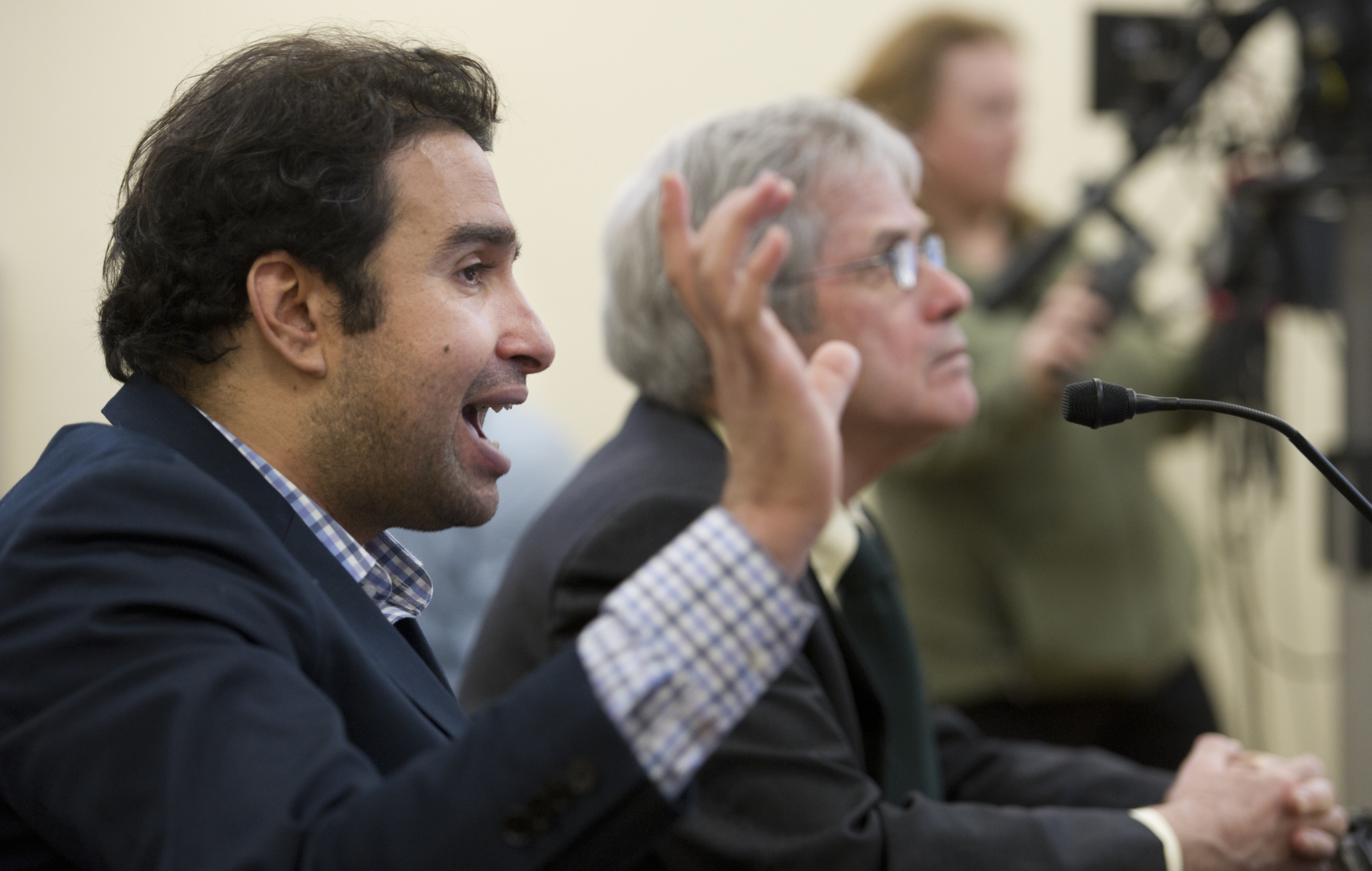 Mouhcine Guettabi, an assistant professor of cconomics at the Institute of Social and Economic Research at the University of Alaska Anchorage, left, Ralph Townsend, Director of ISER, give an overview of Alaska economic health to the Senate Labor and Commerce Commttee at the Capitol on Wednesday. (Michael Penn | Juneau Empire)