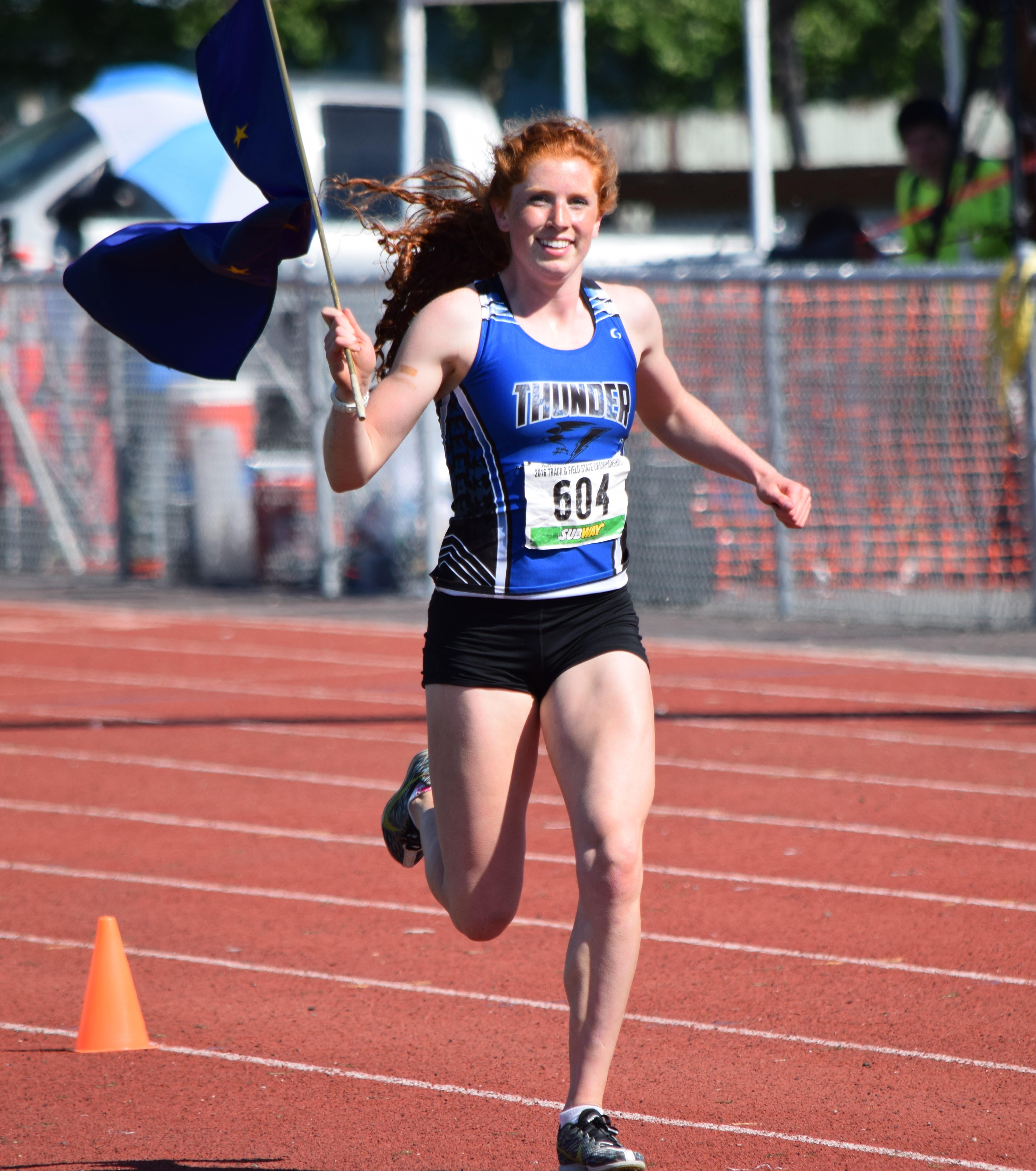 Thunder Mountain High School's Naomi Welling celebrates during the state track and field championships in Anchorage. Welling won the 300­-meter hurdles with a blistering state ­record time of 43.49 seconds.