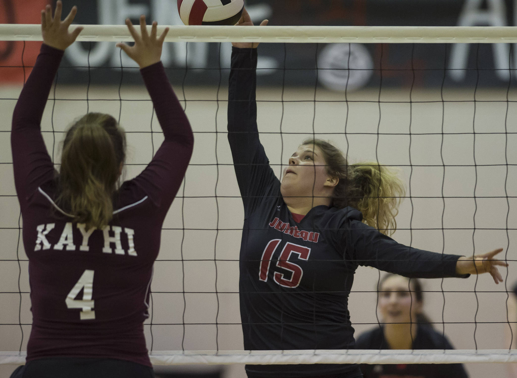 Juneaus Skylar Hickok spikes against Ketchikans Jenae Rhoads at Juneau-Douglas High School on Friday, Aug. 31, 2018. (Michael Penn | Juneau Empire)