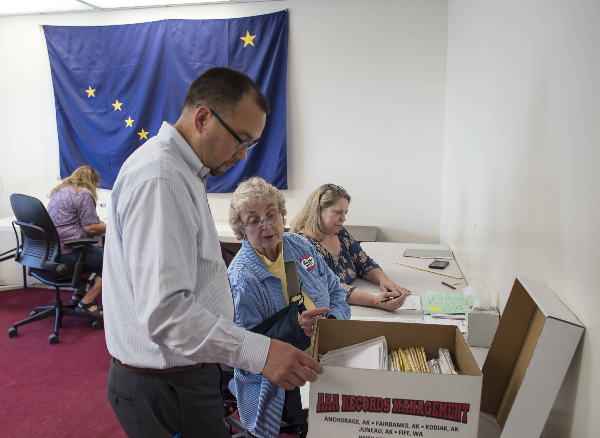 Brian Jackson, State of Alaska’s Elections Program Manager, helps answer a question from Alaska Review Board members Stuart Sliter, center, and Lynda Thater-Flemmer during the final certification of the state’s primany election at the state’s election office in downtown Juneau on Tuesday, Sept. 4, 2018. (Michael Penn | Juneau Empire)