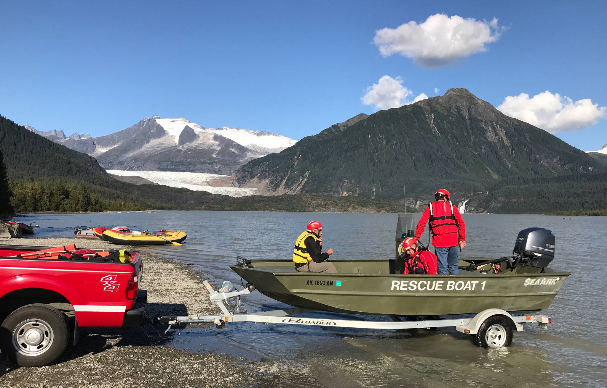 Capital City Fire/Rescue launches their rescue boat to rescue David Hill, of Dallas, Texas, after he capsized in kayak in front of the Mendenhall Glacier on Tuesday, Sept. 4, 2018. (Michael Penn | Juneau Empire)