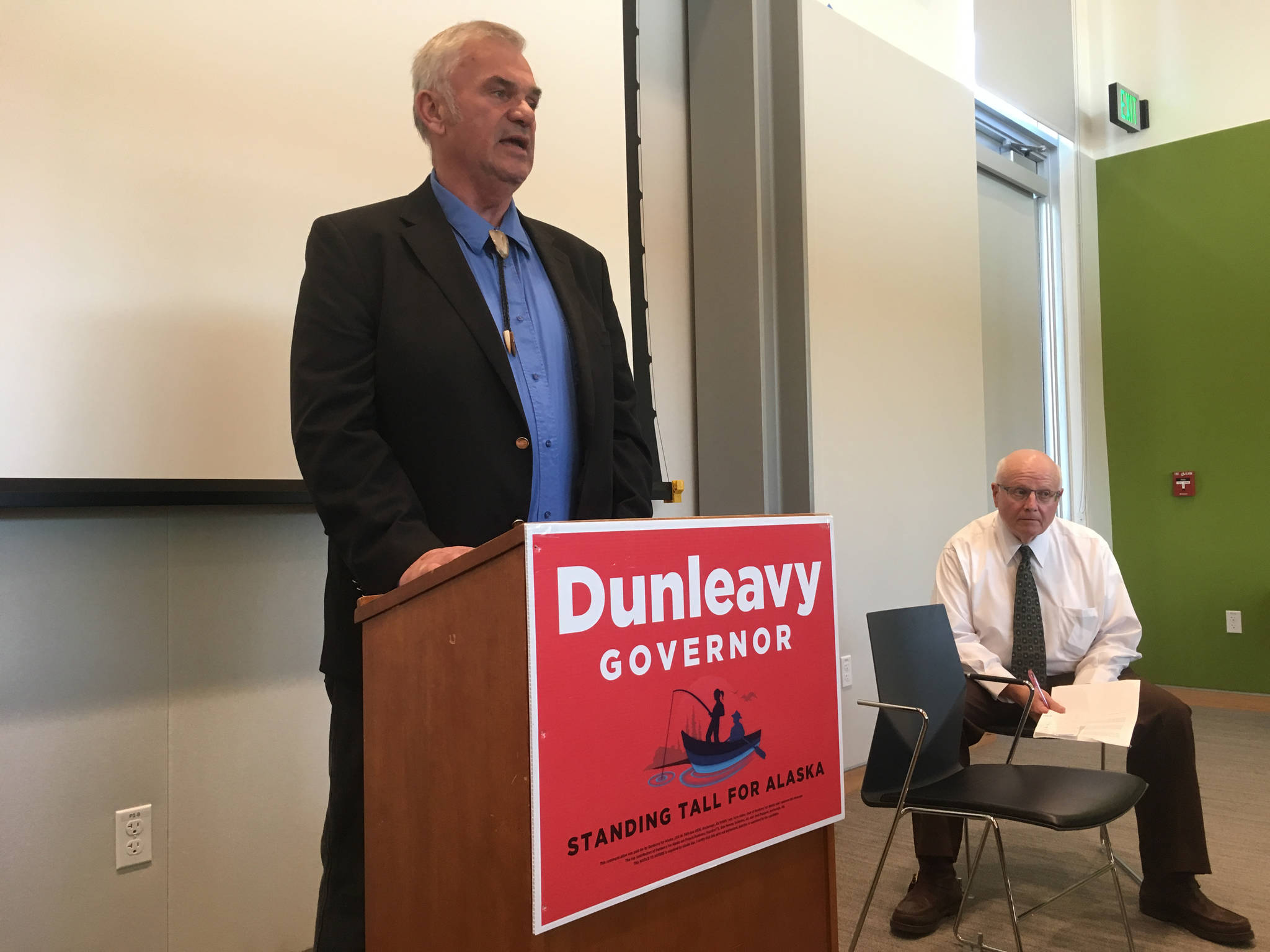Senate District Q candidate Don Etheridge, left, tells his crime story at a Mike Dunleavy for governor campaign event Wednesday, Sept. 5, 2018 in the Mendenhall Valley Public Library. At right is Tom Boutin, one of the organizers of the event. (James Brooks | Juneau Empire)