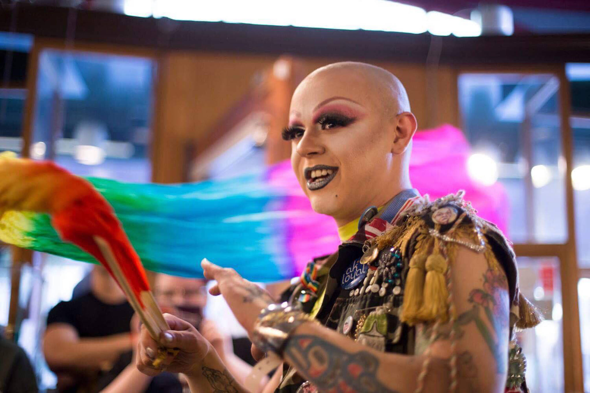 Ricky Tagaban smiles at a Tiny Desk concert at Kindred Post. Tagaban said his work in drag and weaving are both related to gender identity. Photo by Annie Bartholomew.
