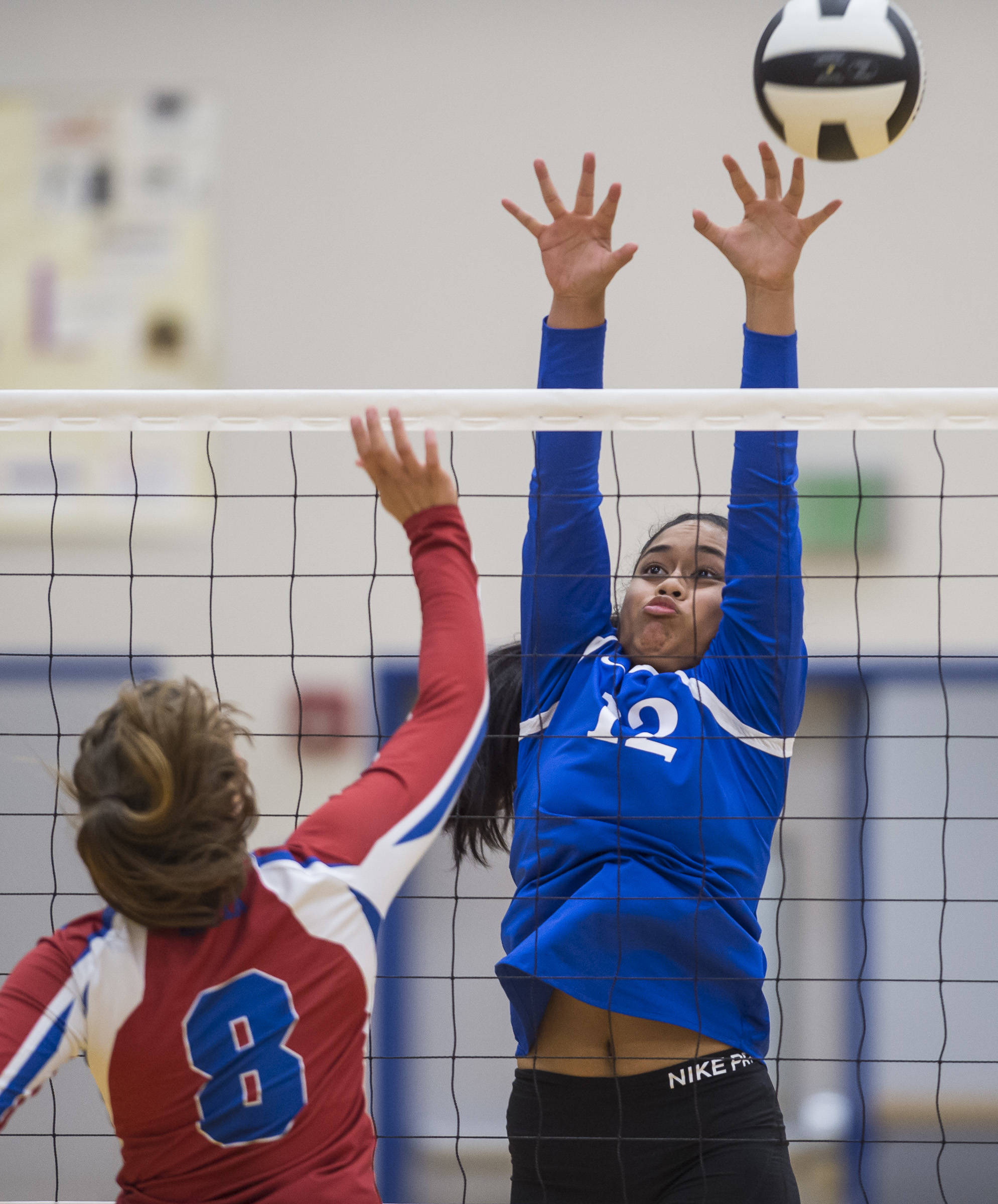 Thunder Mountain’s Mariah Tanuvasa-Tuvaifale, right, attempts to block a shot by Sitka’s Avery Voron at Thunder Mountain High School on Friday, Sept. 7, 2018. Thunder Mountain won 3-0 (25-15, 25-21, 25-16). (Michael Penn | Juneau Empire)