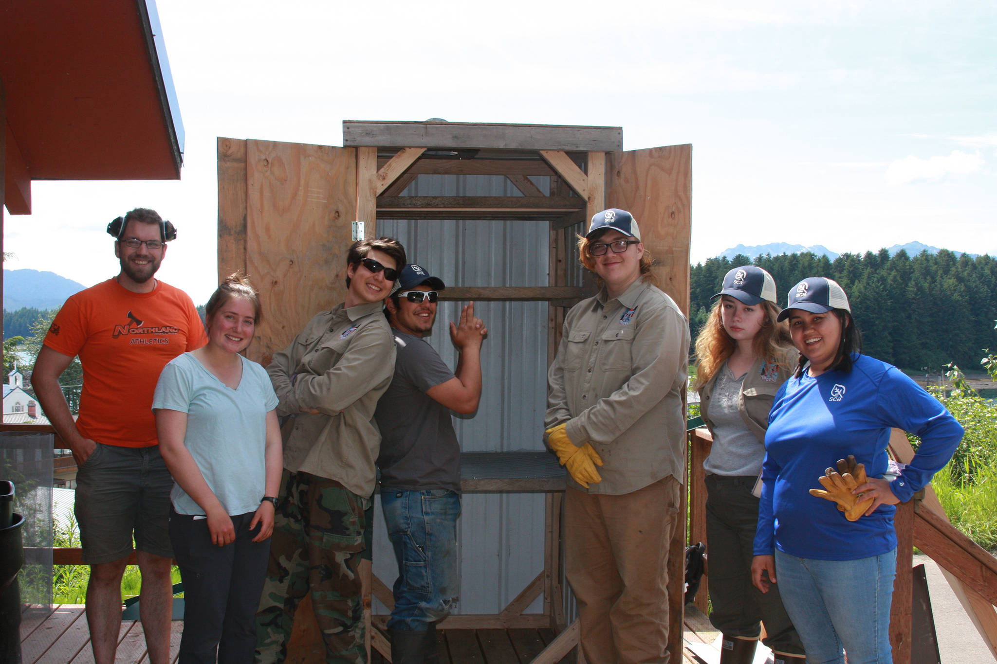 TRAYLS crew stands with the completed smokehouse for Culture Camp. From left : Ian Johnson, Eva Bingham, Dawson Hollingsworth, Sam Sheakley, Nicholaus Treutel-Jacobsen, Ashlyn Gray, Rebekah Sawers. (Courtesy Photo | Sean Williams)