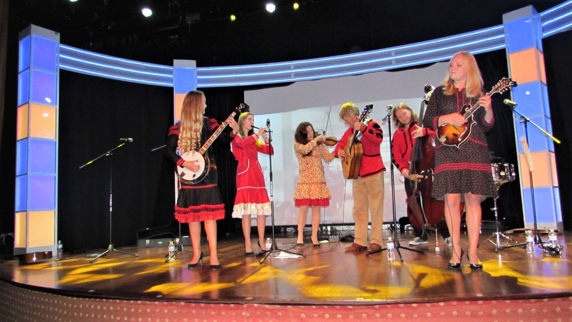 Abigail, Emily, Melissa, Paul, Quinn and Laura Zahasky, collectively known as the Alaska String Band, perform on board a cruise ship in Juneau. Paul and Melissa are the mother and father of Laura, Quinn and Abigail, and Emily married into the band and family after marrying Quinn. While Emily played the clarinet growing up, she did not play a string instrument before Quinn came into her life. Now, she plays several. “I was very motivated,” Emily said. (Ben Hohenstatt | Capital City Weekly)
