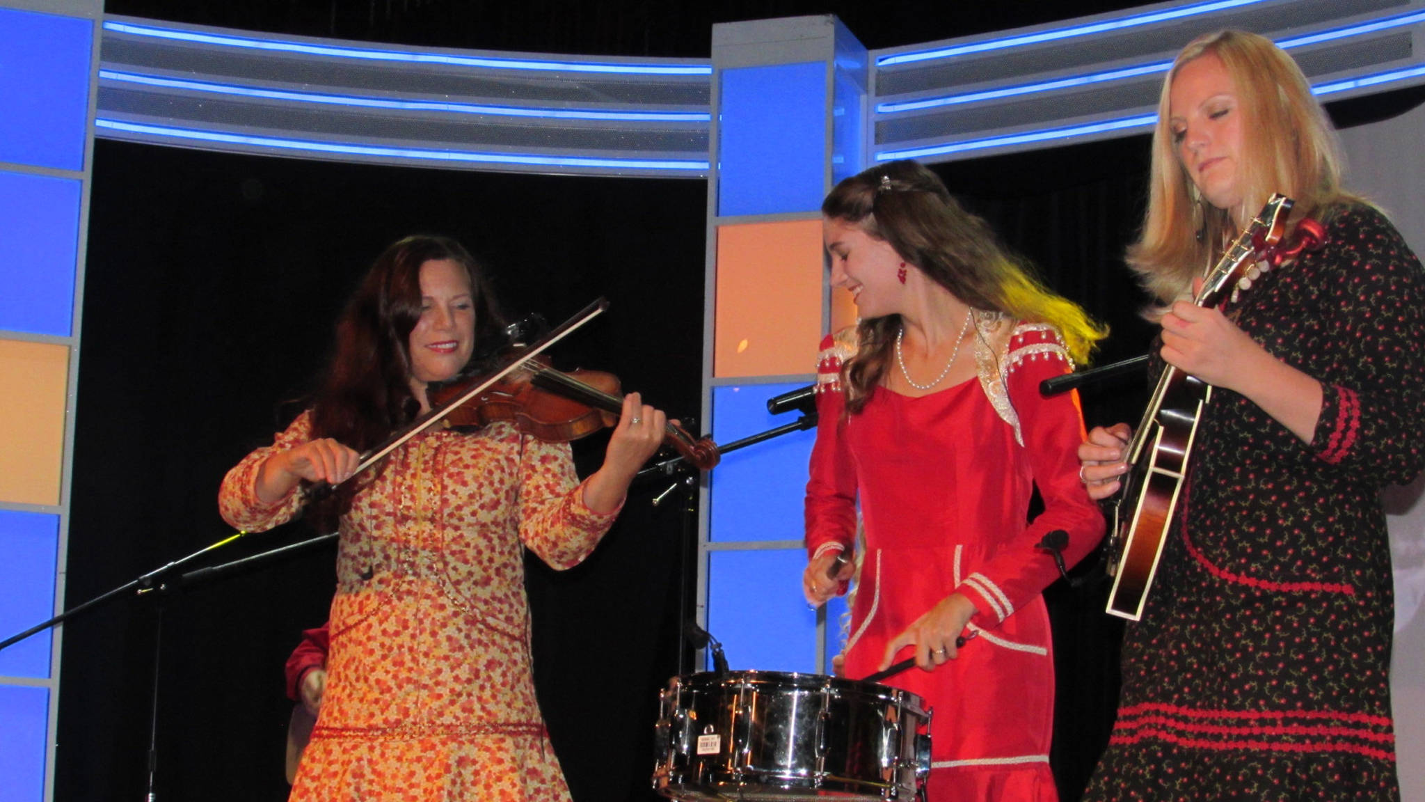 Melissa Zahasky, Emily Zahasky and Laura Zahasky of the Alaska String Band perform onboard the Silver Shadow cruise ship in Juneau. The six-member Americana band consists of members of the Zahasky family and splits the year between playing cruise ships in Juneau during the summer and touring in the winter. Recently, the Alaska String Band celebrated the Fourth of July by performing for the U.S. Embassy in Vladivostok, Russia. (Ben Hohenstatt | Capital City Weekly)