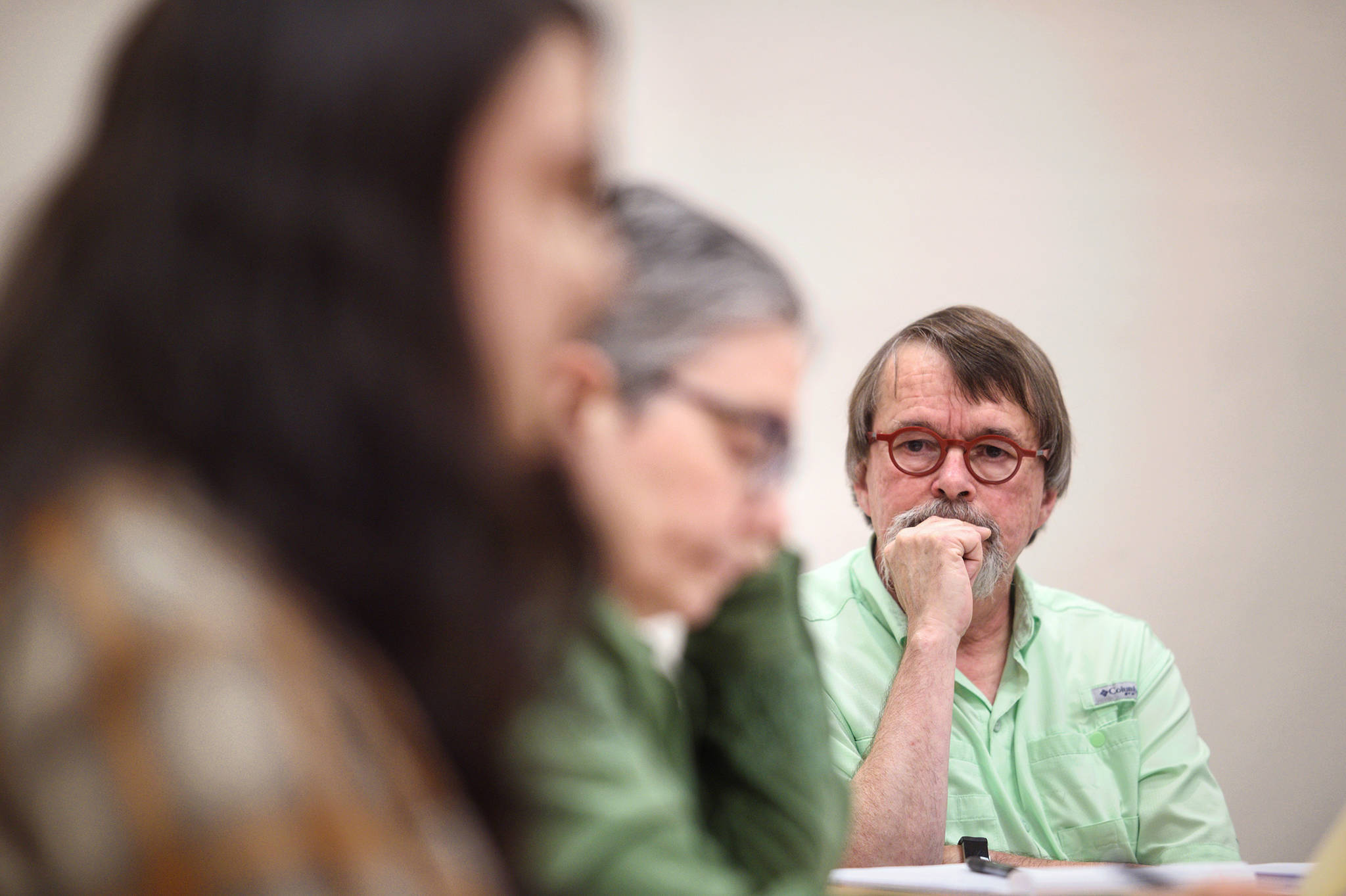 KTOO President and General Manager Bill Legere watches public testimony at the public radio station’s board meeting on Monday, Sept. 10, 2018. (Michael Penn | Juneau Empire)