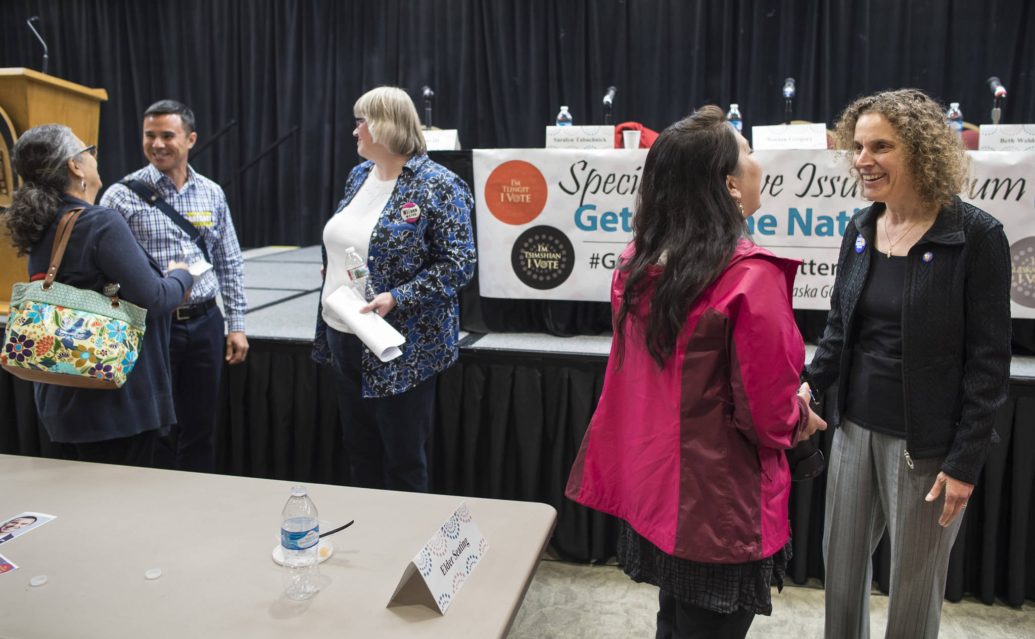 Mayoral candidates Saralyn Tabachnick, right, Gregory Norton, left, and Beth Weldon, center, speak to Juneau residents after a Special Native Issues Forum at the Elizabeth Peratrovich Hall on Tuesday, Sept. 18, 2018. (Michael Penn | Juneau Empire)
