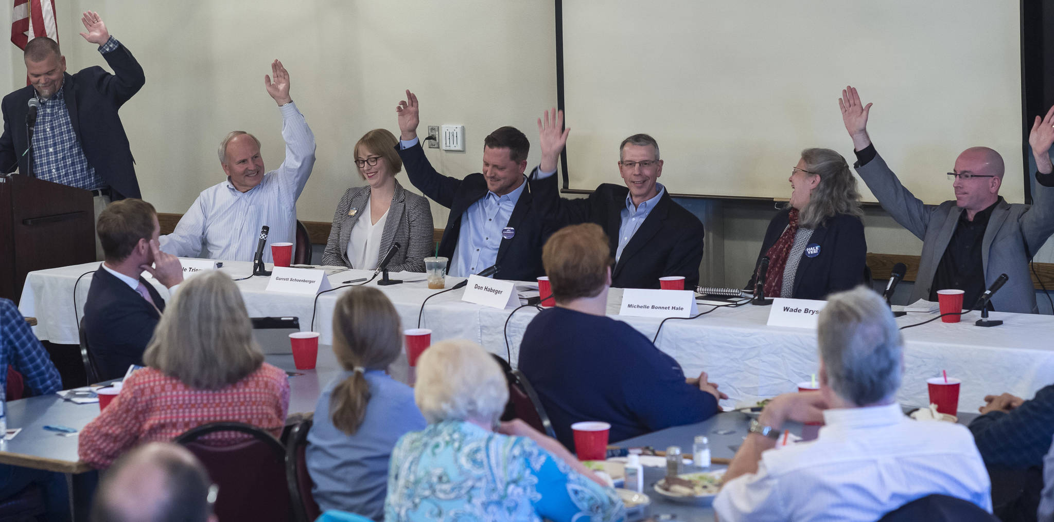 Juneau Assembly candidates for the Areawide and District 2 seats are asked to raise their hand if they support the Juneau Access Project during a forum at the Juneau Chamber of Commerce during its weekly luncheon at the Moose Lodge on Thursday, Sept. 20, 2018. District 2 candidate Emil Mackey did not attend the event because of work travel. (Michael Penn | Juneau Empire)