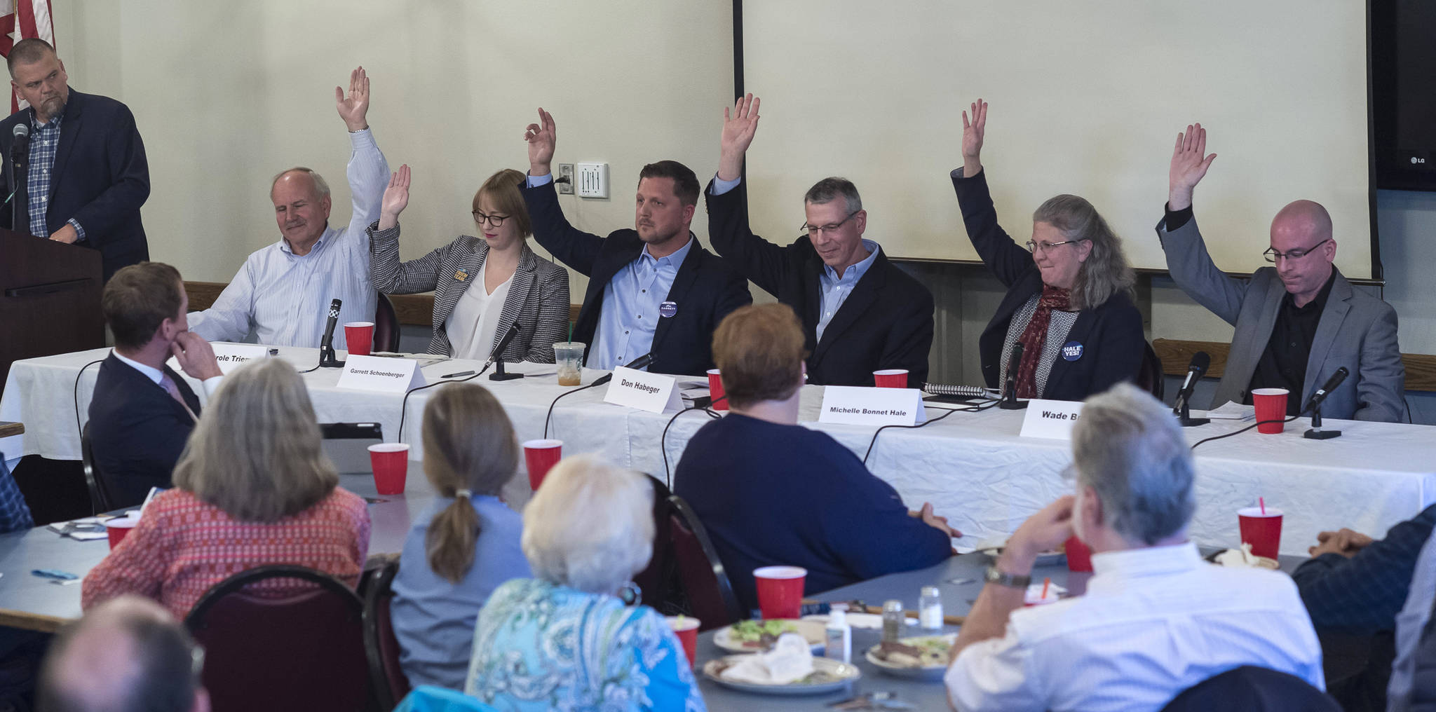 Juneau Assembly candidates for the Areawide and District 2 seats are asked to raise their hand if they support a second crossing to Douglas Island during a forum at the Juneau Chamber of Commerce during its weekly luncheon at the Moose Lodge on Thursday, Sept. 20, 2018. District 2 candidate Emil Mackey did not attend the event because of work travel. (Michael Penn | Juneau Empire)