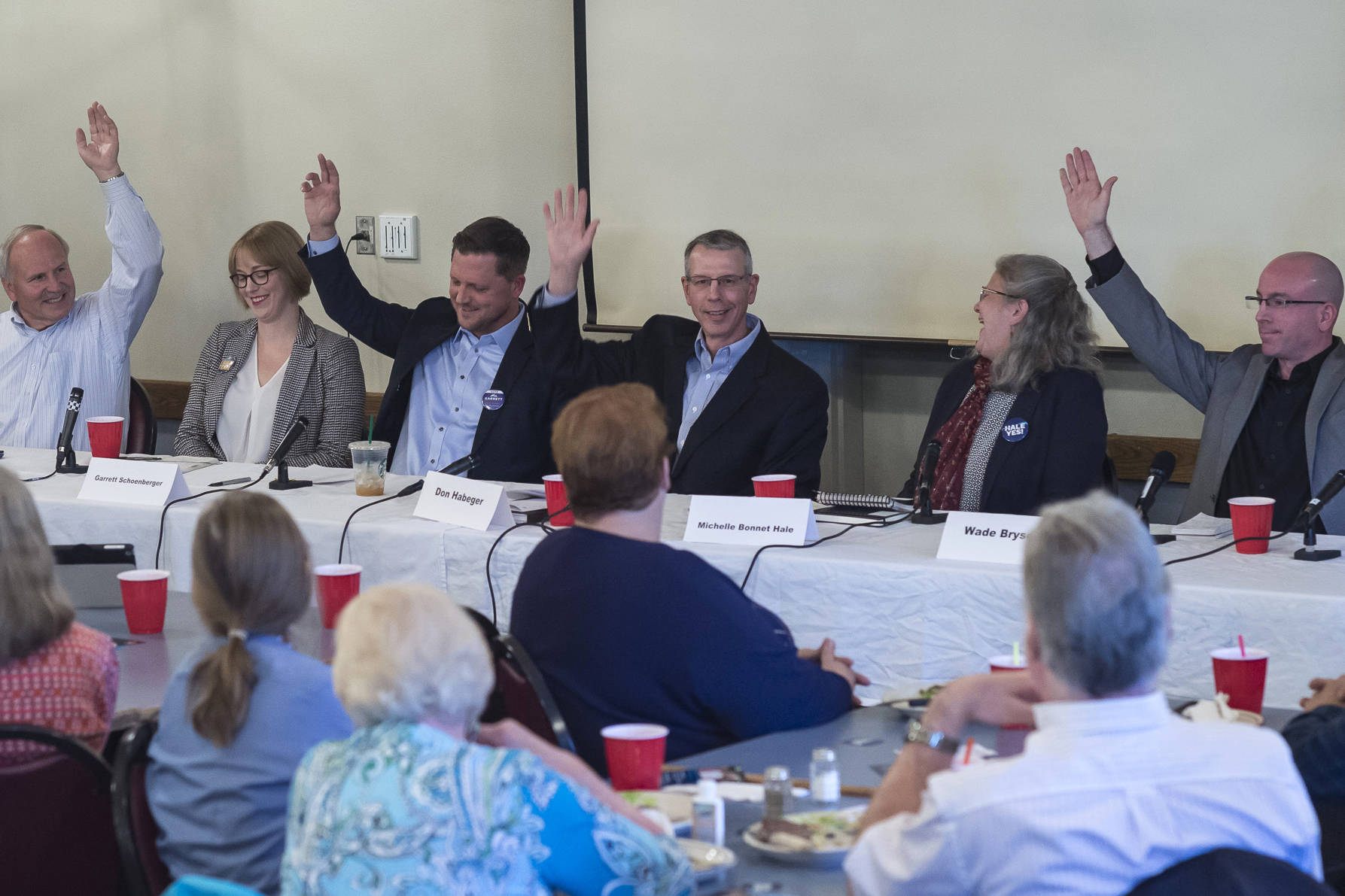 Juneau Assembly candidates for the Areawide and District 2 seats are asked to raise their hand if they support the Juneau Access Project during a forum at the Juneau Chamber of Commerce during its weekly luncheon at the Moose Lodge on Thursday, Sept. 20, 2018. District 2 candidate Emil Mackey did not attend the event because of work travel. (Michael Penn | Juneau Empire)
