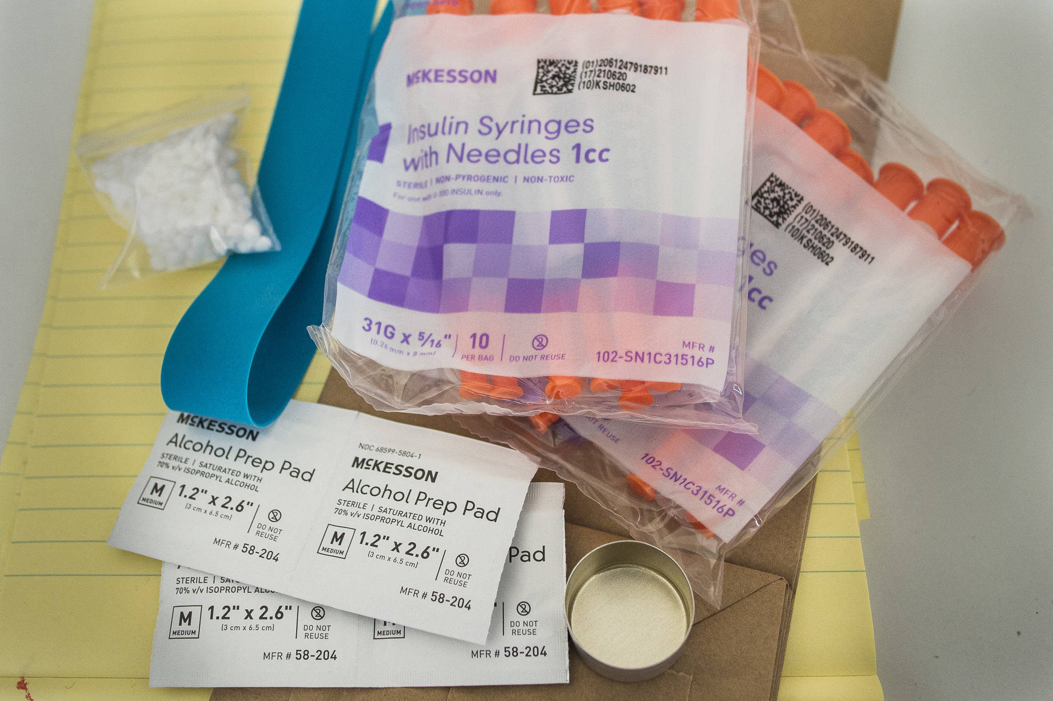 A drug user kits with clean syringes at the Four A’s office on Friday, Sept. 21, 2018. Juneau’s Four A’s office in Juneau is in danger of closing because of a lack of funding, and are employing a crowdfunding approach to try and gain $15,000 by Oct. 15. (Michael Penn | Juneau Empire)