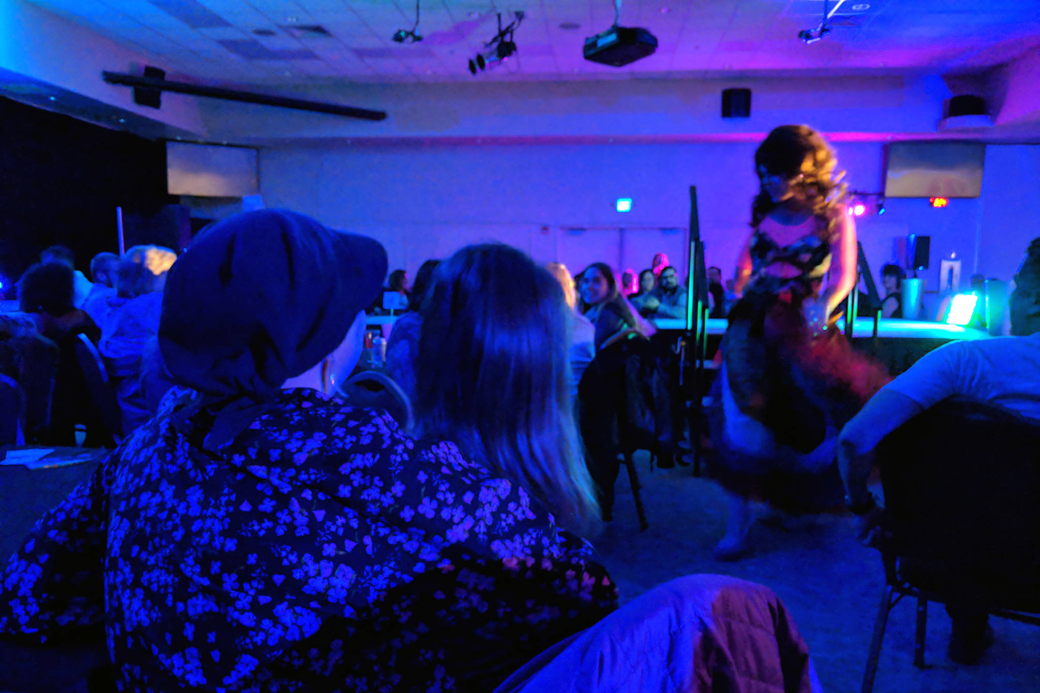 Mary Folletti Cruise and her daughter, Enza, watch drag queen Lituya Hart during the Besties 4 Breasties drag show fundraiser that benefitted Folletti Cruise, who has been diagnosed with Stage 3 breast cancer. In a few weeks, she will travel to Seattle for treatment. (Ben Hohenstatt | Capital City Weekly)