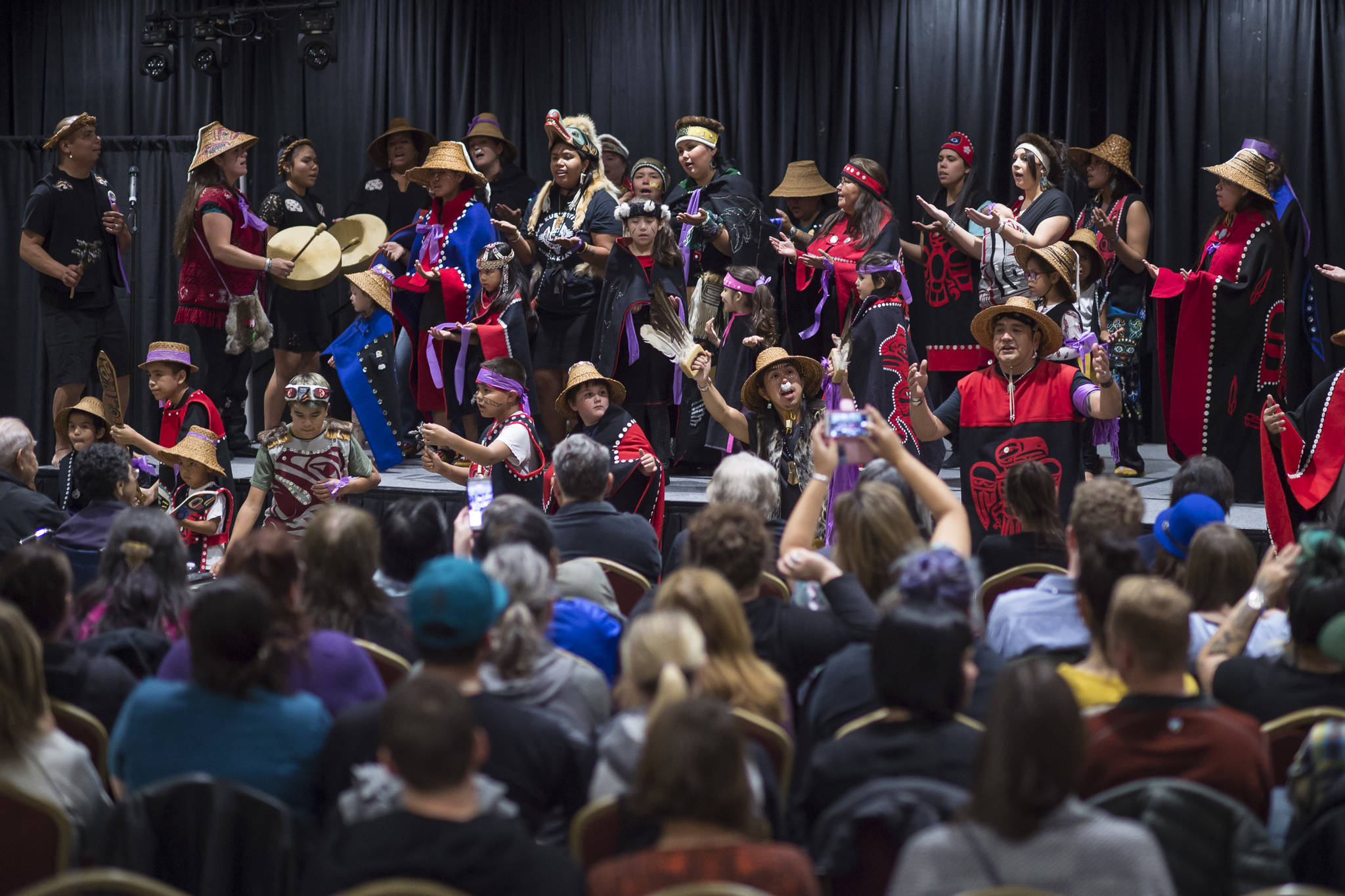 The Woosh.ji.een Dance Group makes a special performance at the Indigenous people performance titled “You Don’t Have To Go Home, But You Can’t Stay Here” at the Elizabeth Peratrovich Hall on Monday, Sept. 24, 2018. (Michael Penn | Juneau Empire)