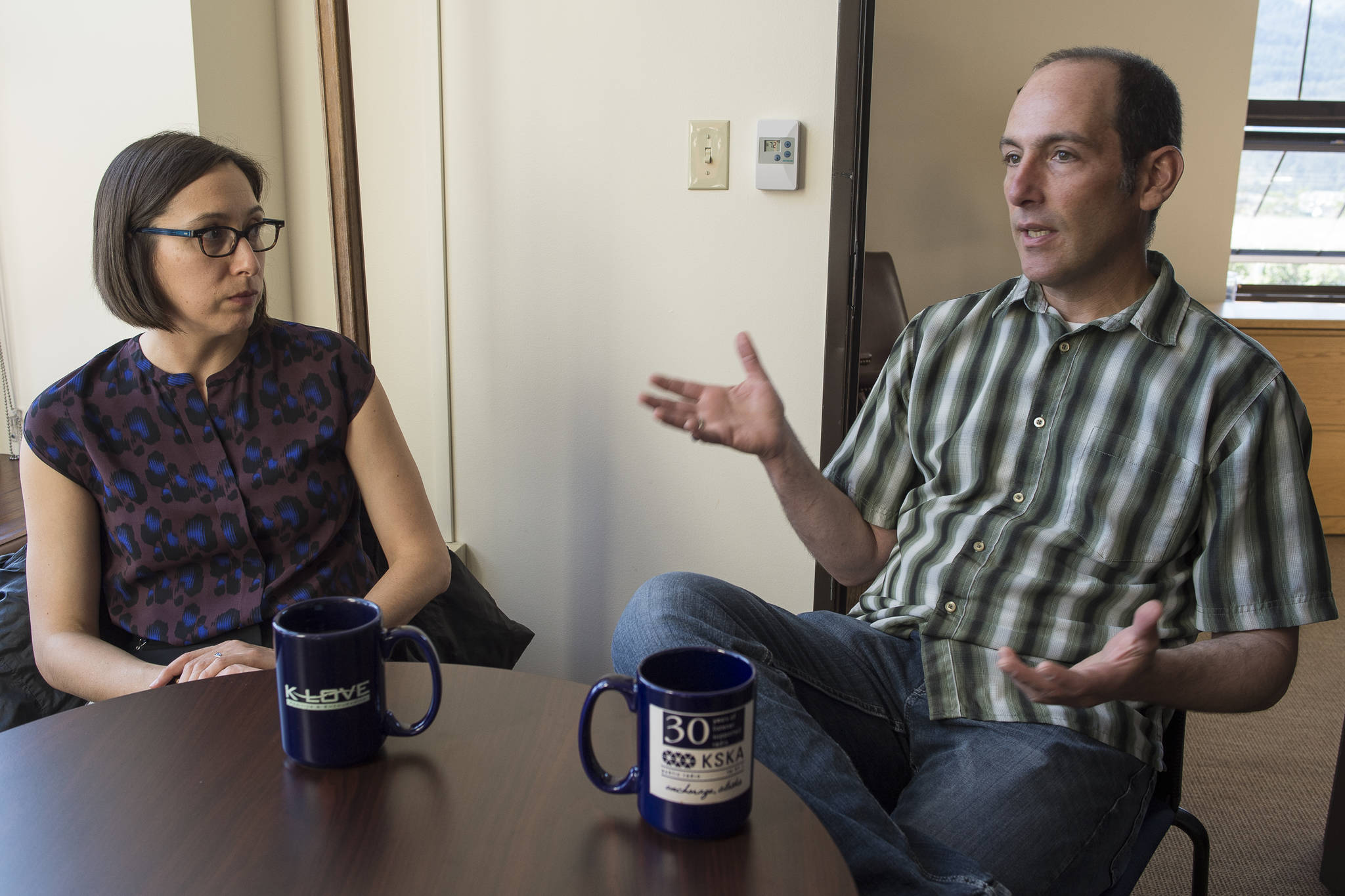 A Senior Advisor to Gov. Bill Walker, Nikoosh Carlo, left, and Michael LeVine, a member of Walker’s climate change task force, talk about upcoming recommendations on Thursday, Sept. 6, 2018. (Michael Penn | Juneau Empire)