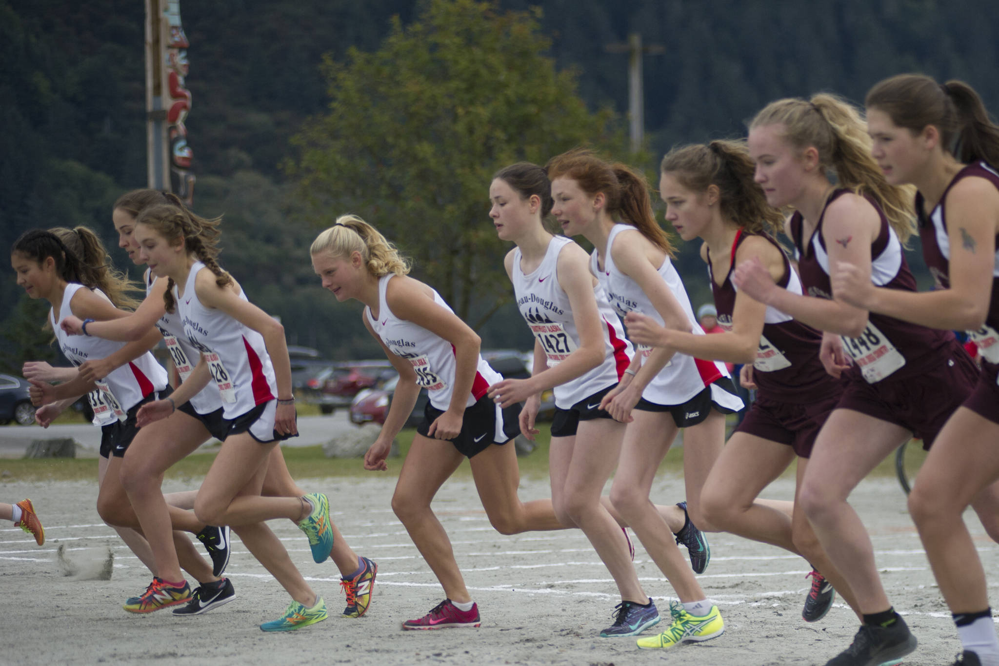 Juneau-Douglas High School’s Sadie Tuckwood, middle, is one of a handful of favorites to finish first in the girls state cross country meet on Saturday at Bartlett High School in Anchorage. (Nolin Ainsworth | Juneau Empire)