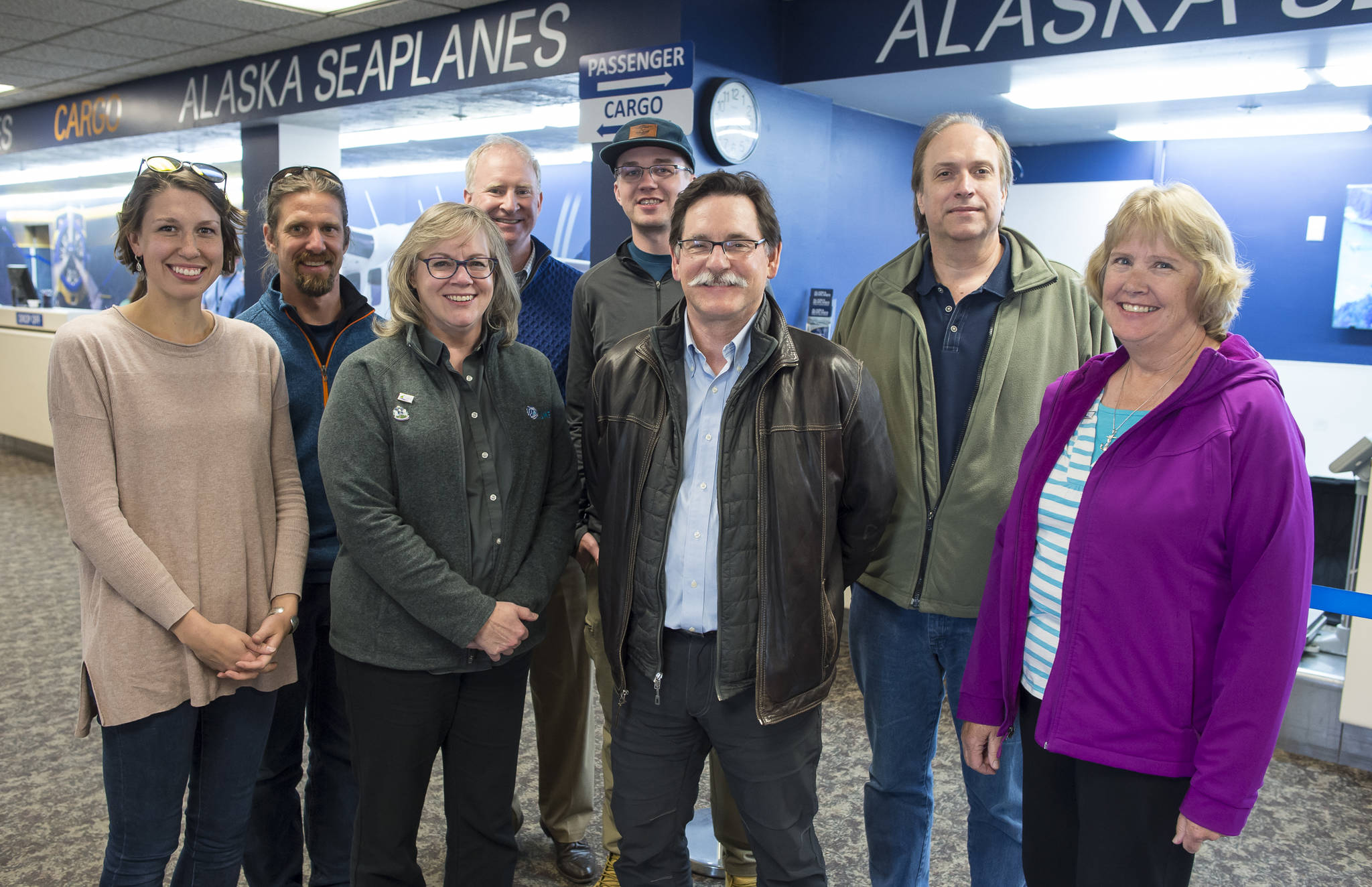 A Juneau delegation poses for a picture after returning on the last Alaska Seaplanes flight of the season from an Economic Trade Mission in Whitehorse on Tuesday, Sept. 18, 2018. From left: Mary Berry, Alaska Glacier Seafoods, Dave Scanlan, Eaglecrest, Liz Perry, Travel Juneau, Brian Holst, Juneau Economic Development Council, Charles Herrington, Eaglecrest, Jim Powell, UAS, Keith Comstock, Juneau Hydropower and Barbara Burnett, Juneau Sister Cities Committee. Attending the mission but not pictured are Carl Ramseth, Alaska Seaplanes, and Jerry Burnett. (Michael Penn | Juneau Empire)