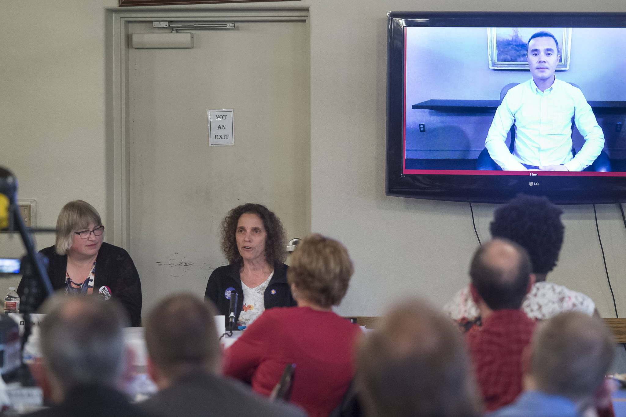 Juneau mayoral candidates Beth Weldon, left, Saralyn Tabachnick and Norton Gregory, via video conference, speak to the Juneau Chamber of Commerce during its weekly luncheon at the Moose Lodge on Thursday, Sept. 27, 2018. (Michael Penn | Juneau Empire)