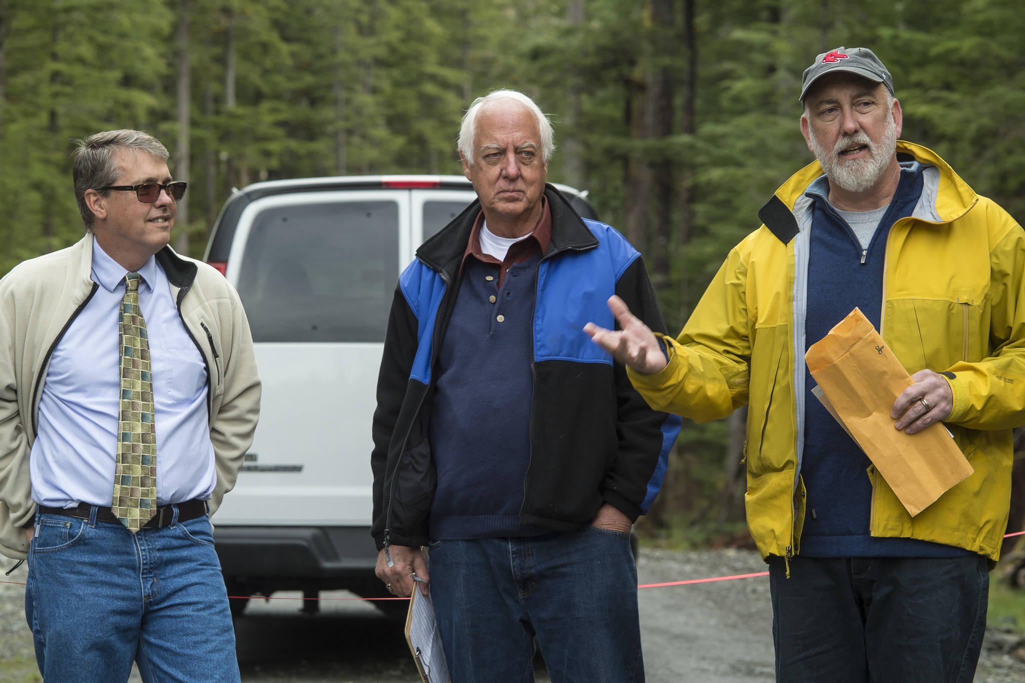 Mike Vigue, Director of the city’s Engineering and Public Works Department, right, speaks as Mayor Ken Koelsch, center, and City Manager Rorie Watt wait their turn during a ribbon cutting ceremony to officially open the West Douglas Pioneer Road on Friday, Sept. 28, 2018. (Michael Penn | Juneau Empire)