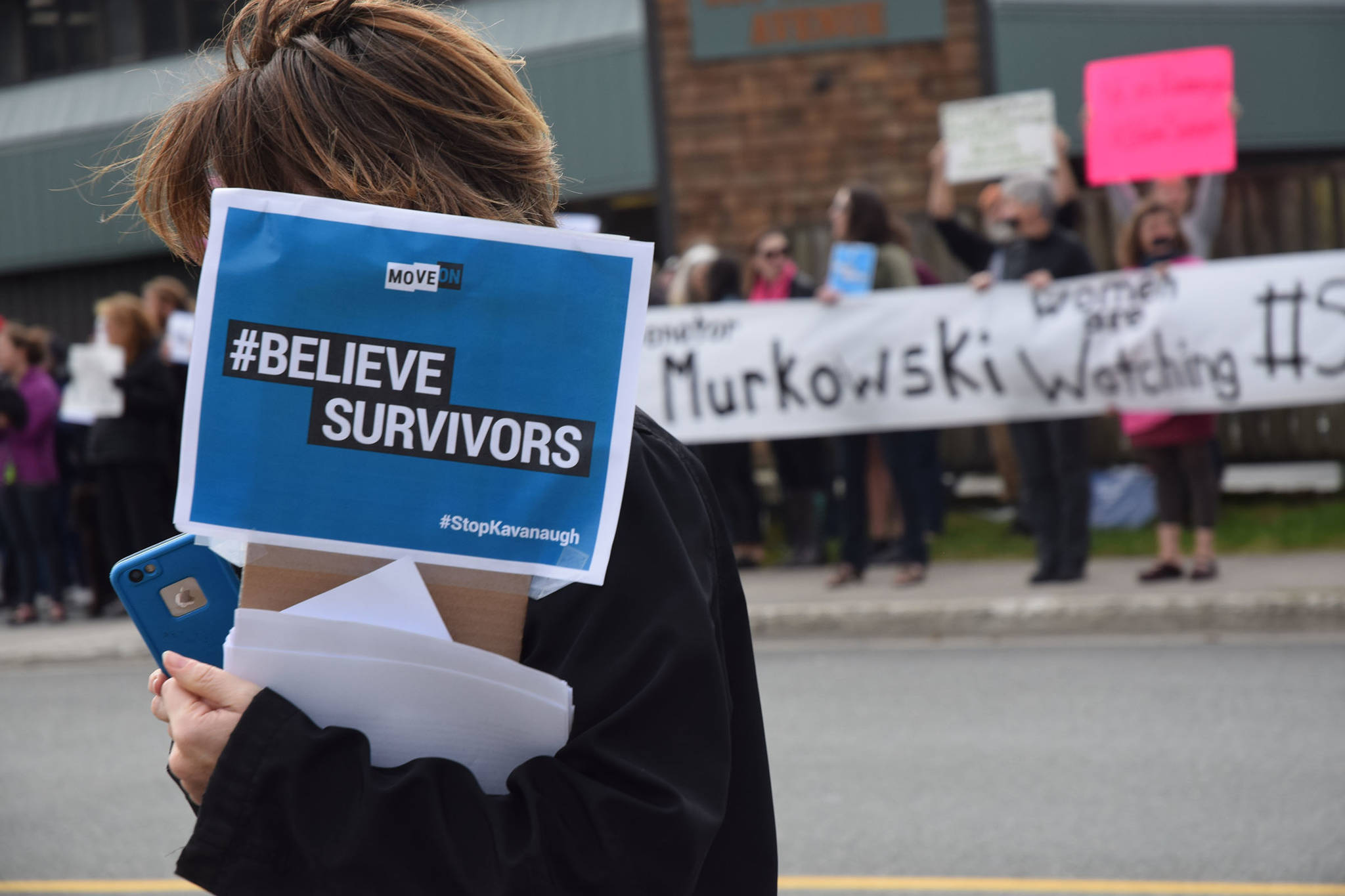 Protestors rallied Friday at the Juneau office of U.S. Sen. Lisa Murkowski, who will soon vote on the nomination of Judge Brett Kavanaugh to the U.S. Supreme Court. The group of about 130 urged Murkowski to vote against the nomination of Kavenaugh, who is accused of sexual assault. (Kevin Gullufsen | Juneau Empire)