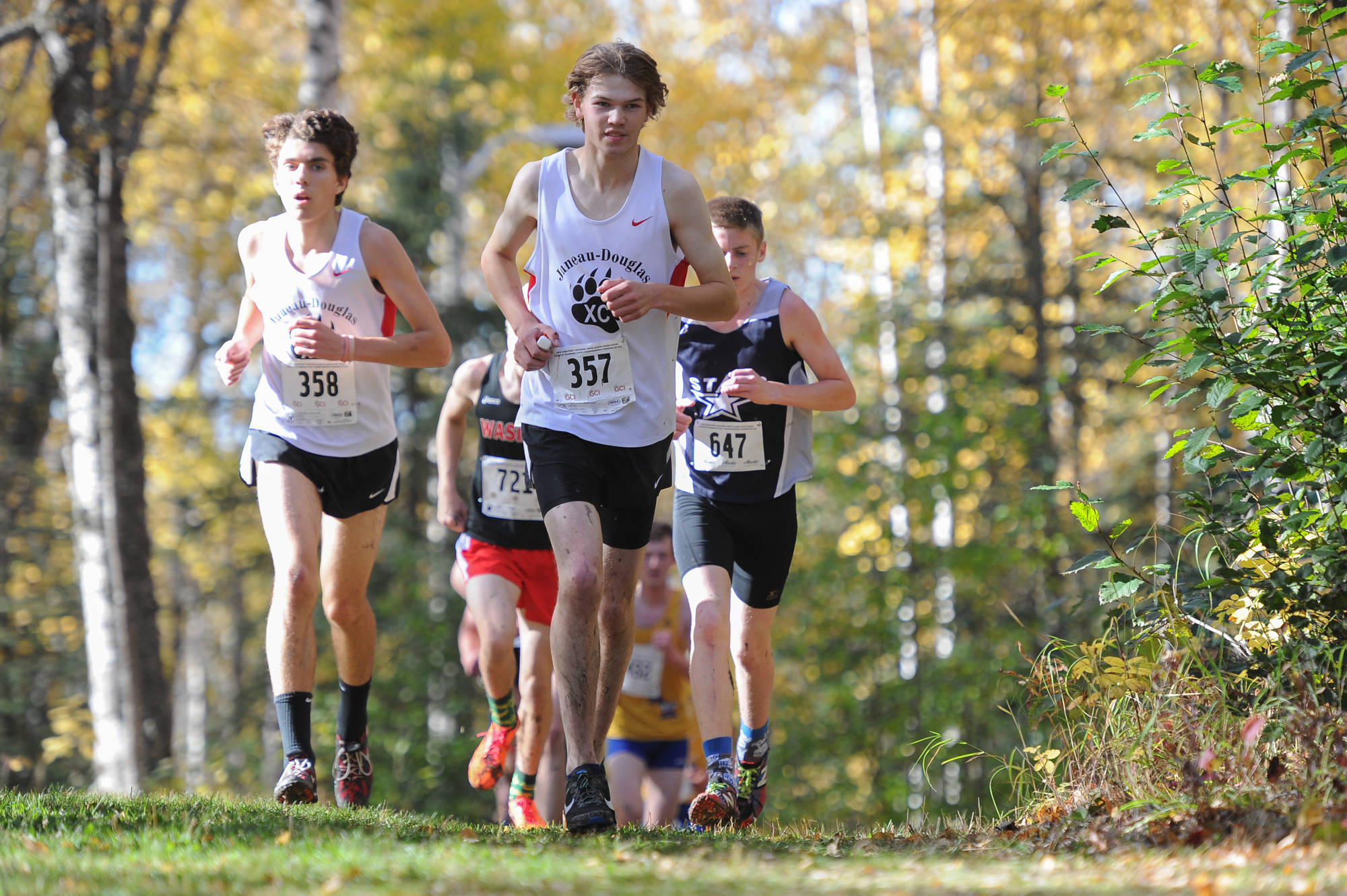 Dalton Hoy, right, and Ronan Davies, left, on the course. (Michael Dineen | For the Juneau Empire)