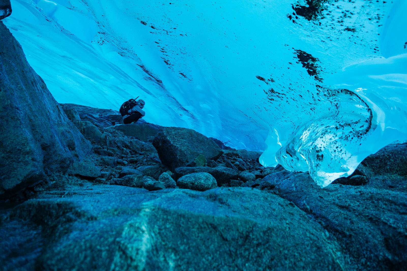 Katie McCaffrey exploring the belly of the glacier. (Gabe Donohoe | For the Juneau Empire)