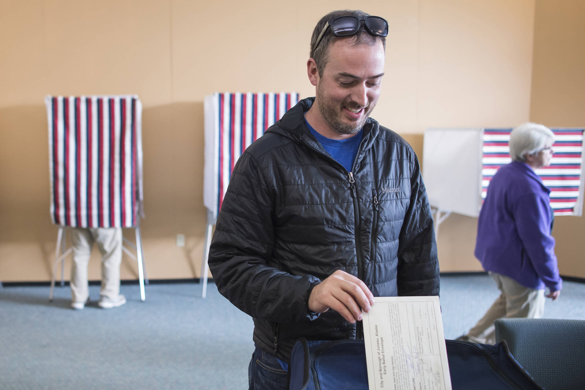 Trenton English takes advantage of early voting in the municipal election at the Mendenhall Mall Annex on Monday, Sept. 17, 2018. (Michael Penn | Juneau Empire)