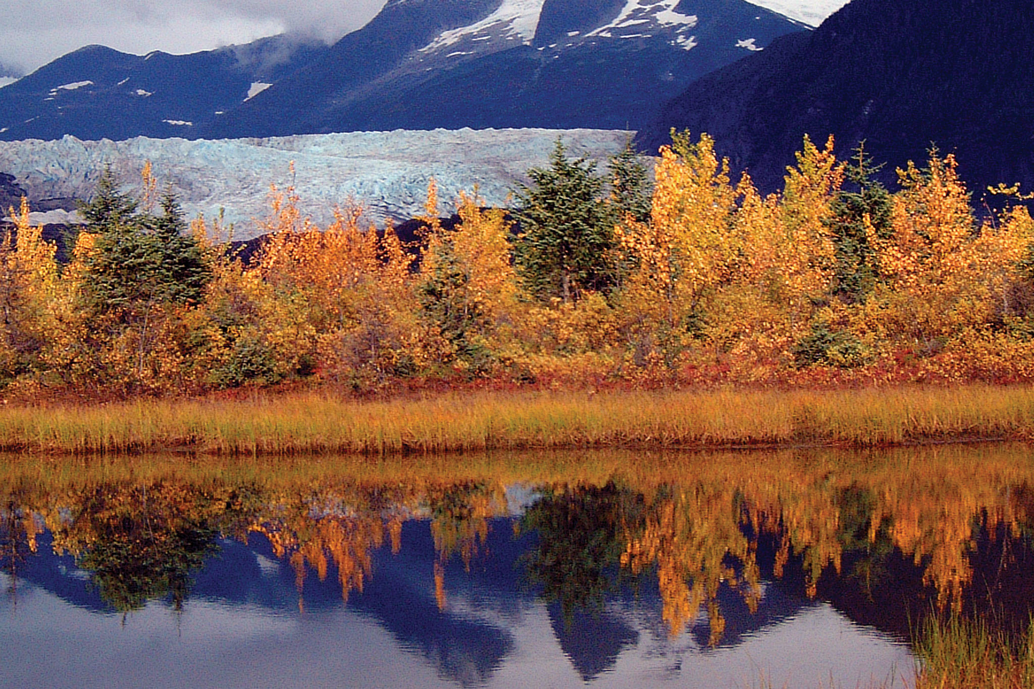 Brilliant fall foliage reflected in a pond near the glacier. (Courtesy Photo | Bob Armstrong)