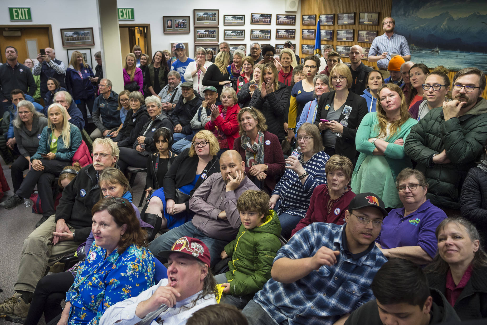 A packed house watches during Election night in the Assembly chambers on Tuesday, Oct. 2, 2018. (Michael Penn | Juneau Empire)
