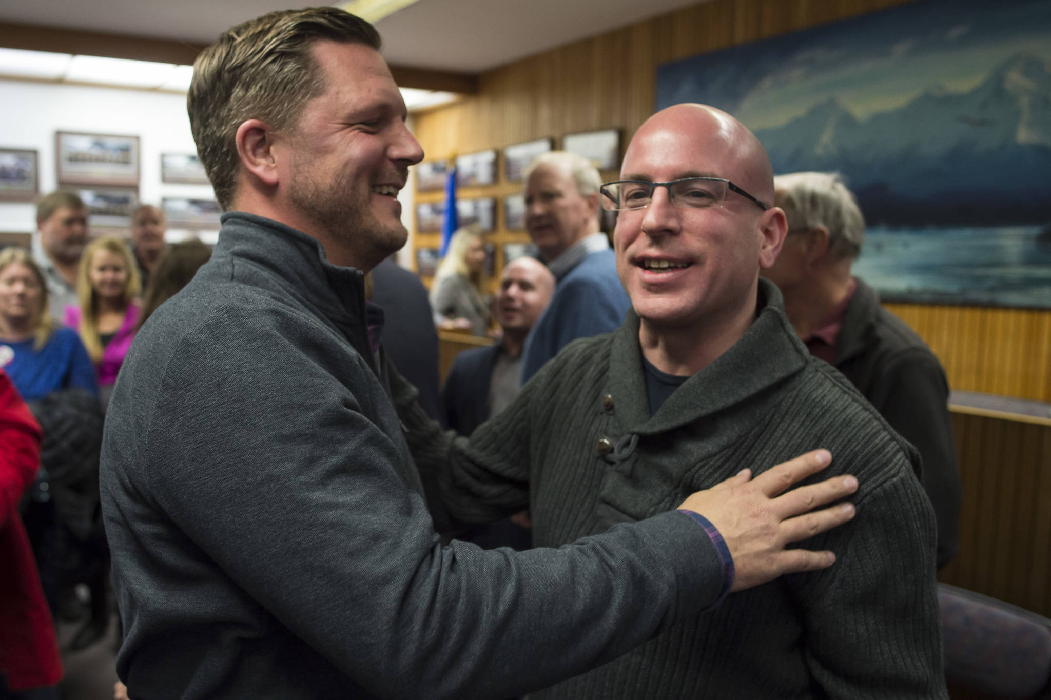 Assembly District 2 candidates Garrett Schoenberger, left, and Wade Bryson greet each other during Election night in the Assembly chambers on Tuesday, Oct. 2, 2018. (Michael Penn | Juneau Empire)