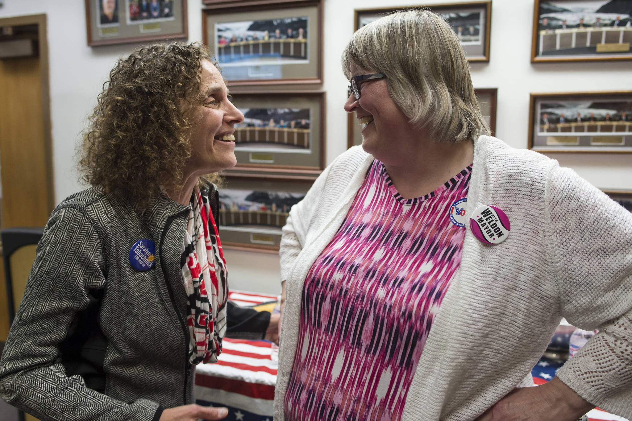 Mayoral candidate Saralyn Tabachnick, left, congratulates Mayor-elect Beth Weldon after watching Election results come in at the Assembly chambers on Tuesday, Oct. 2, 2018. (Michael Penn | Juneau Empire)