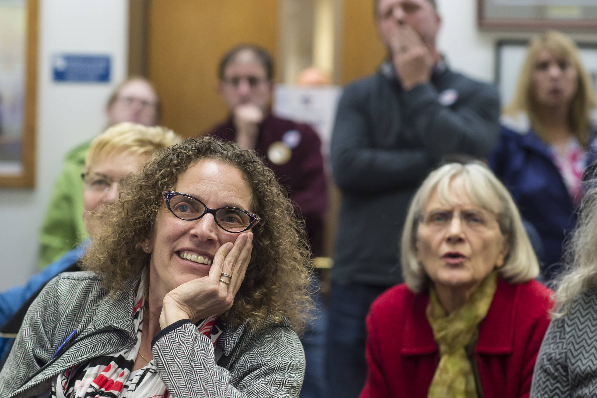 Mayoral candidate Saralyn Tabachnick, left, watches as Election results come in at the Assembly chambers on Tuesday, Oct. 2, 2018. (Michael Penn | Juneau Empire)
