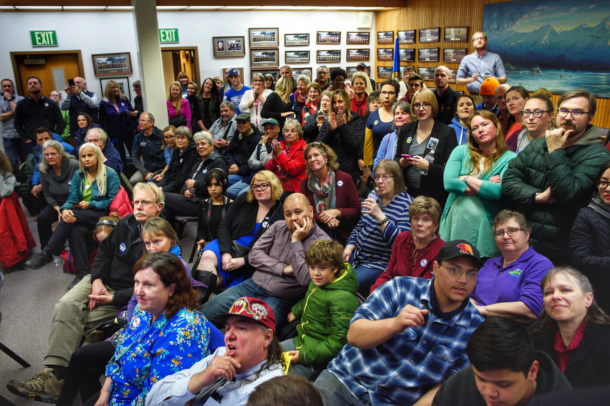 A packed room at City Hall watches as election results come in. (Michael Penn | Juneau Empire)