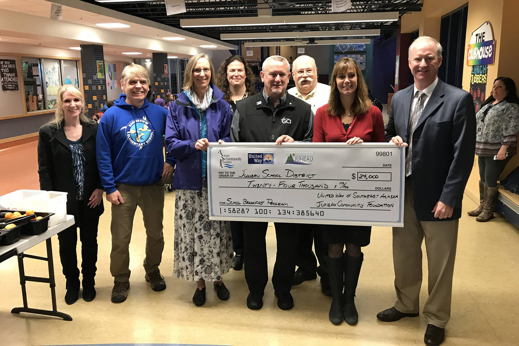 Representatives from the United Way Southeast Alaska, the Juneau School District and the Juneau Community Foundation present a donation to the district on Friday, Oct. 5, 2018. (Kevin Gullufsen | Juneau Empire)