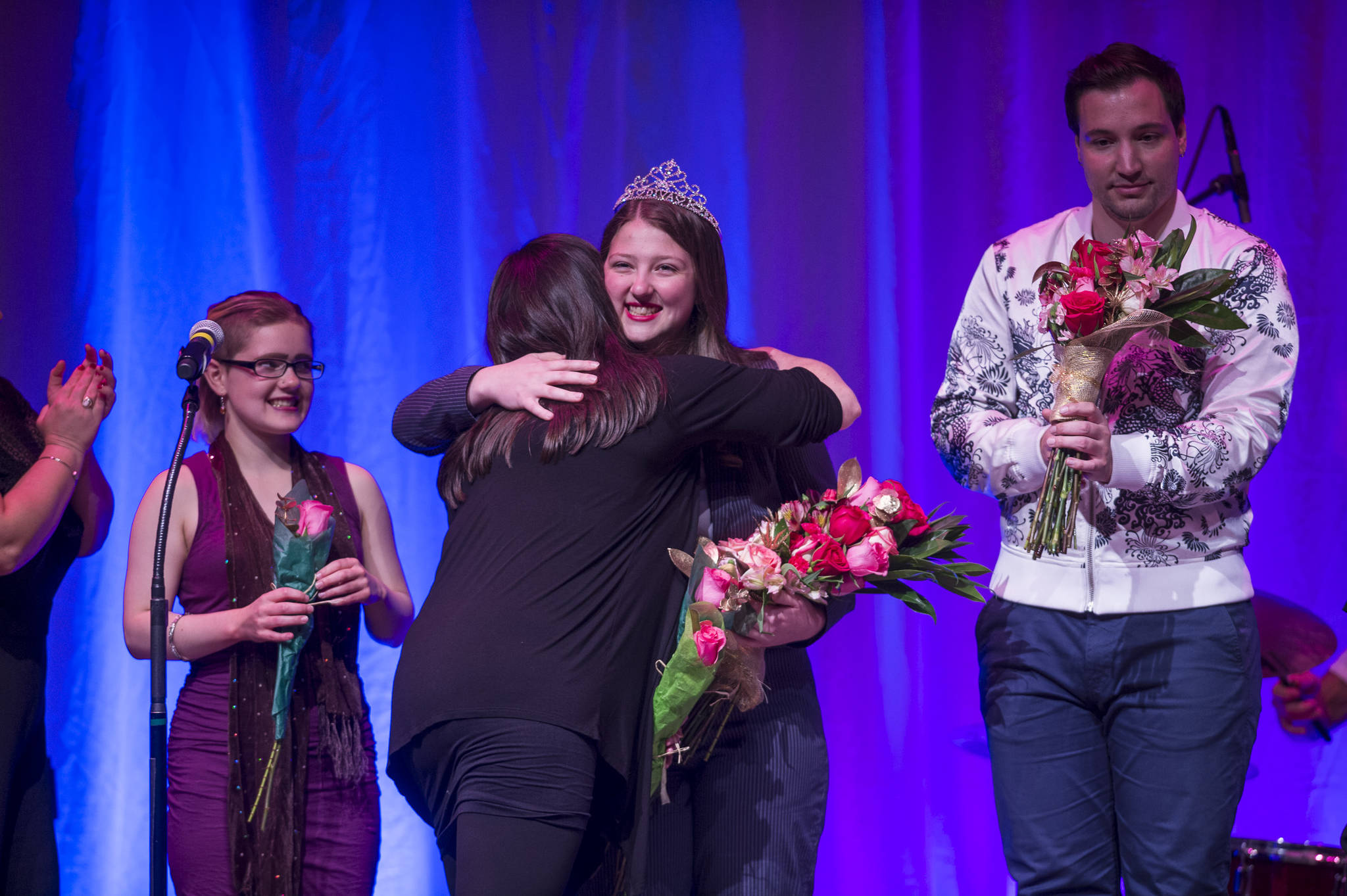 Briannah Letter, center, is crowned the champion Diva with Richard Carter, right, as first runner-up, and Lydia Rail, left, second runner-up, at her side at Juneau Lyric Opera’s production of “Who’s Your Diva?” at Centennial Hall on Saturday, Sept. 29, 2018. (Michael Penn | Juneau Empire)