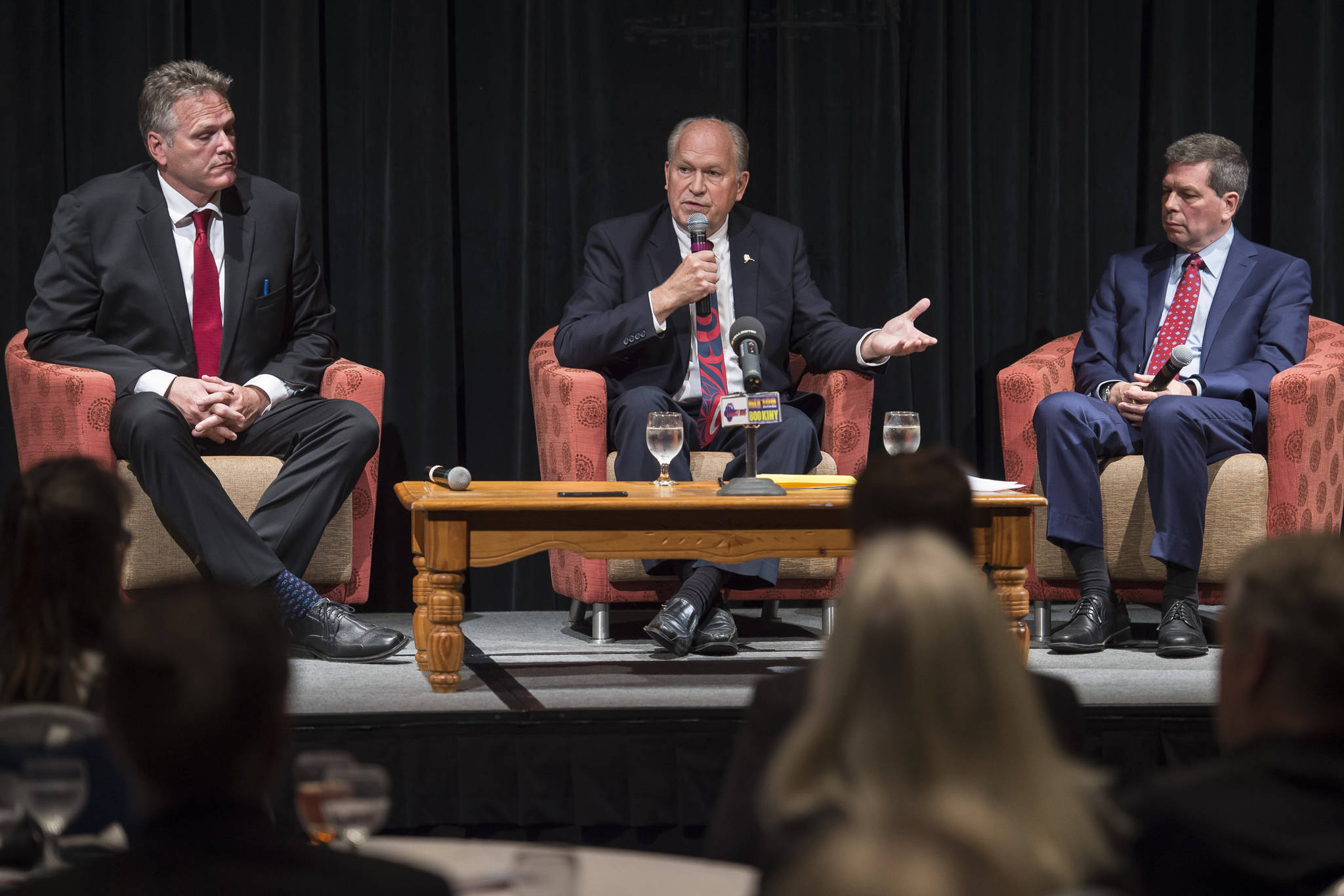 Former state Senate Mike Dunleavy, left, Gov. Bill Walker, center, and former U.S. Senator Mark Begich debate during a Juneau Chamber of Commerce luncheon at Centennial Hall on Thursday, Sept. 6, 2018. Polls and financial disclosure forms show Dunleavy with a significant lead in the four-way governor’s race. (Michael Penn | Juneau Empire)