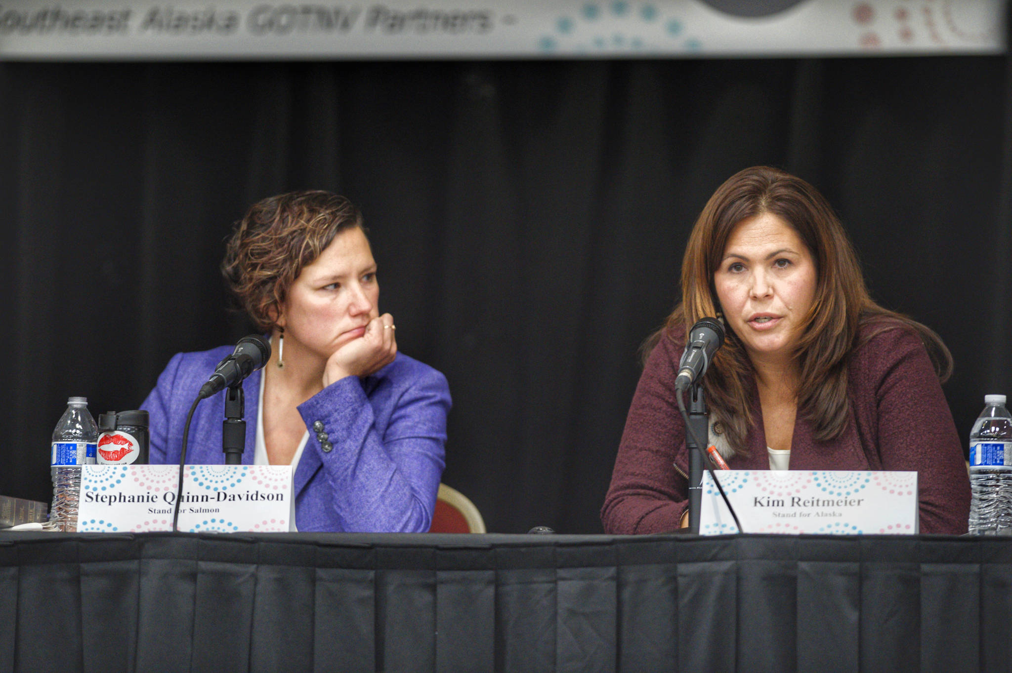 Stephanie Quinn-Davidson, left, of Yes for Salmon, listens as she debates the merits of Ballot Measure 1 with Kim Reitmeier, representing Stand for Alaska, during a Get Out the Native Vote Southeast forum at Elizabeth Peratrovich Hall on Tuesday, Oct. 9, 2018. (Michael Penn | Juneau Empire)