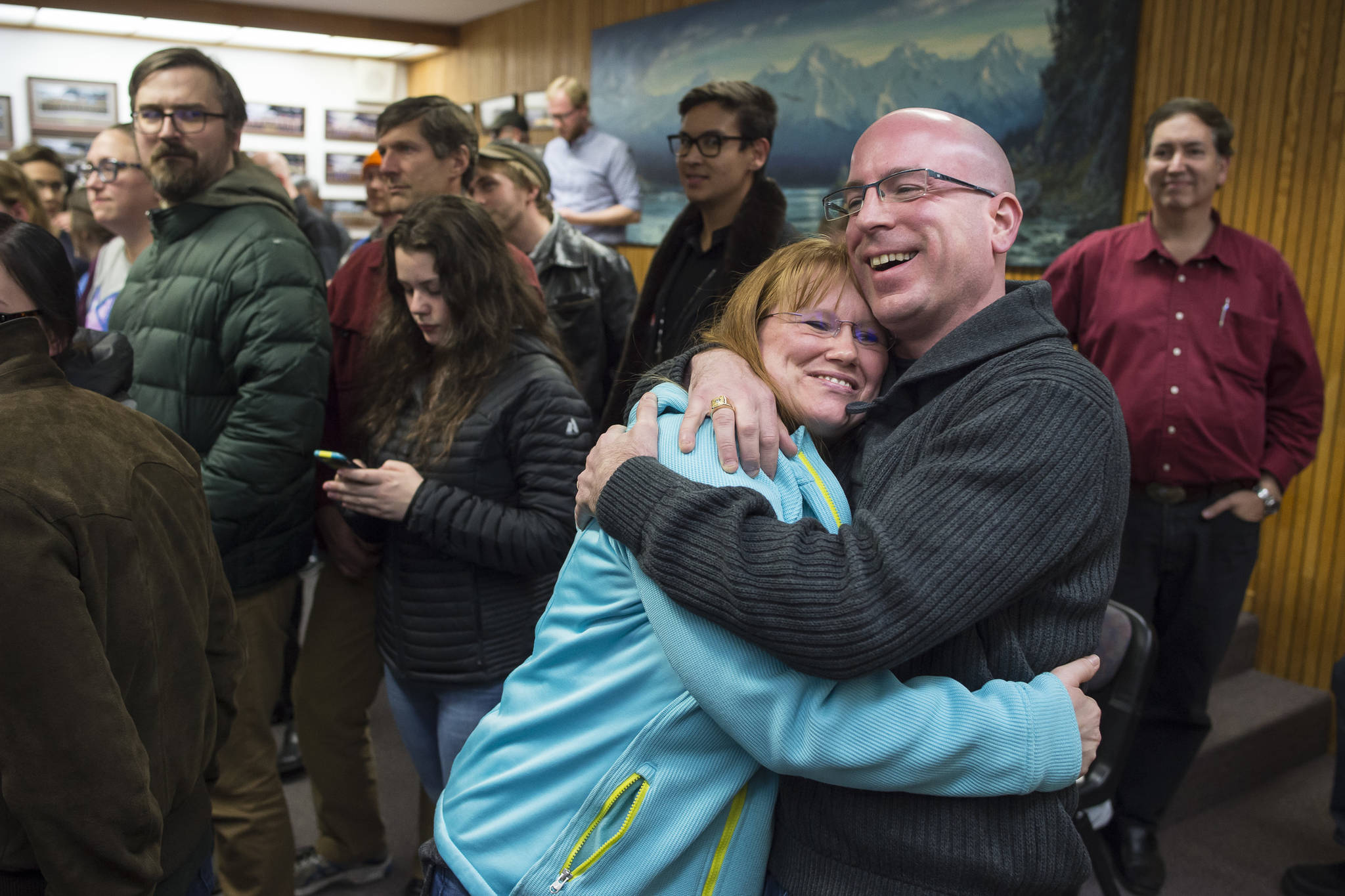 Assembly District 2 Wade Bryson hugs his wife, Christine, as he moves into the second spot during Election night in the Assembly chambers on Tuesday, Oct. 2, 2018. (Michael Penn | Juneau Empire)
