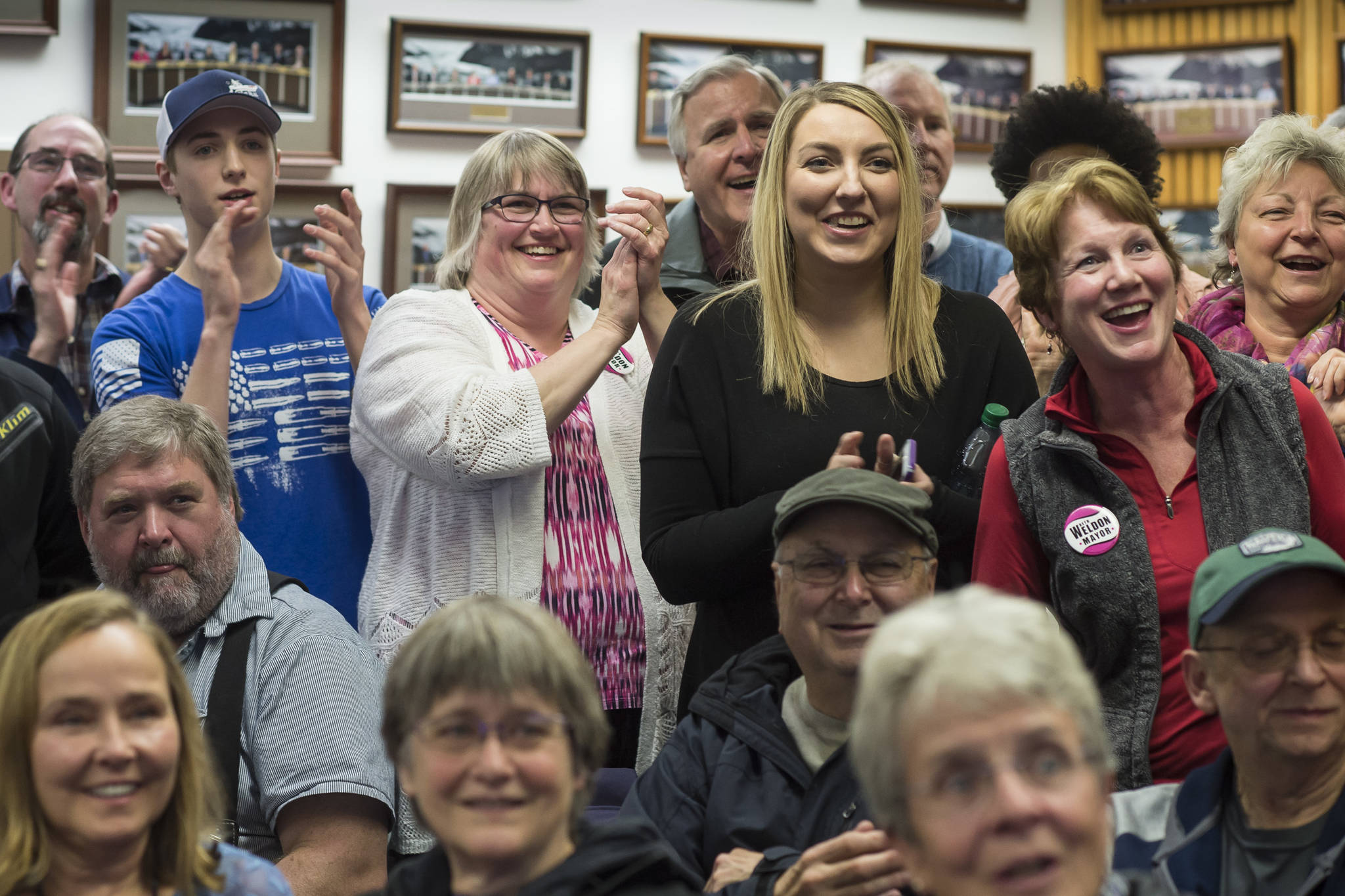 Mayoral candidate Beth Weldon, with family and friends, react as they watch Election results come in at the Assembly chambers on Tuesday, Oct. 2, 2018. (Michael Penn | Juneau Empire)