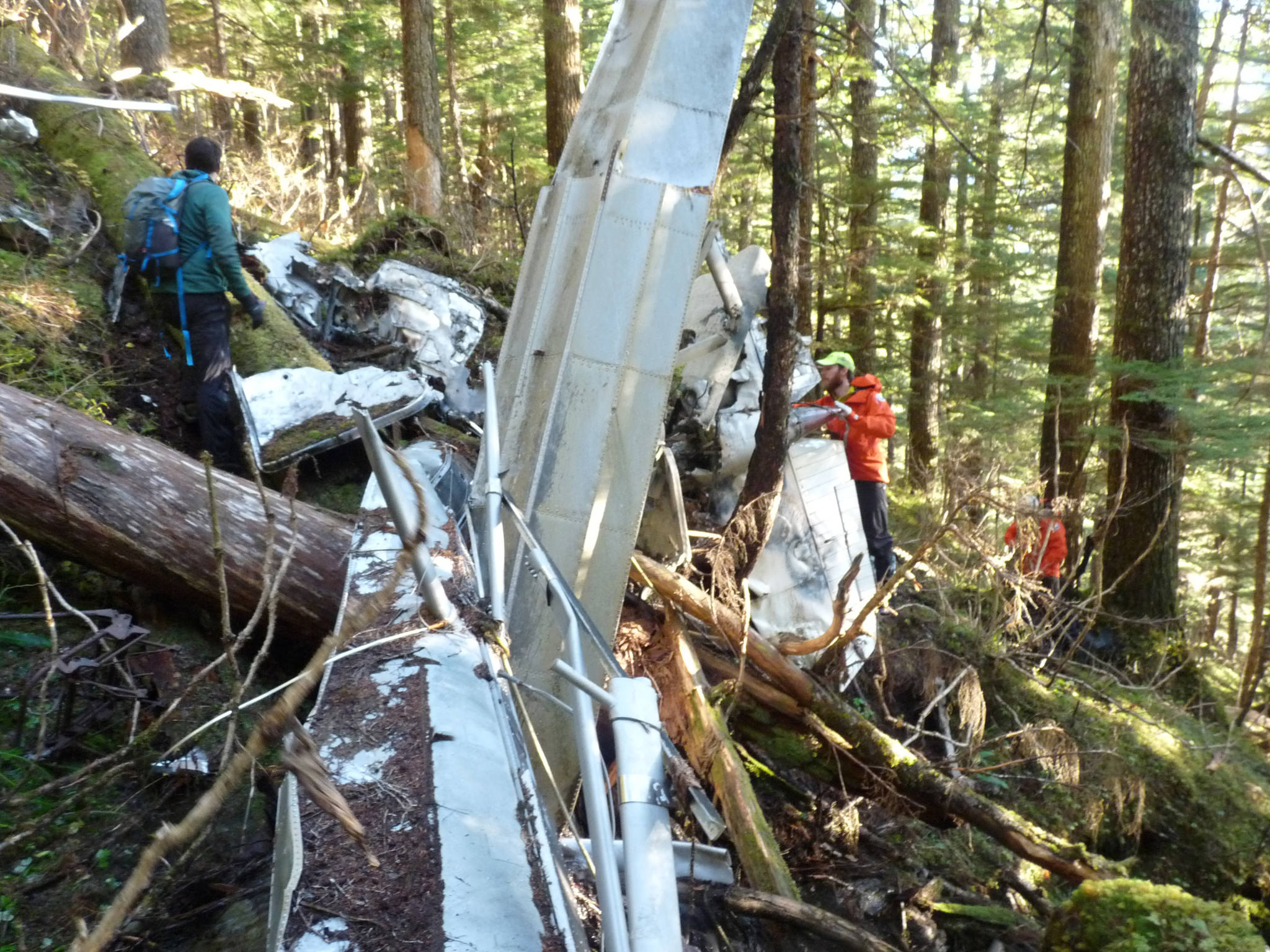 Investigators in October 2017 examine the wreckage of a Cessna 182 airplane that went missing just south of Juneau in 2008. The plane remained undiscovered until it was discovered by a deer hunter. (Alaska State Troopers | Courtesy photo)