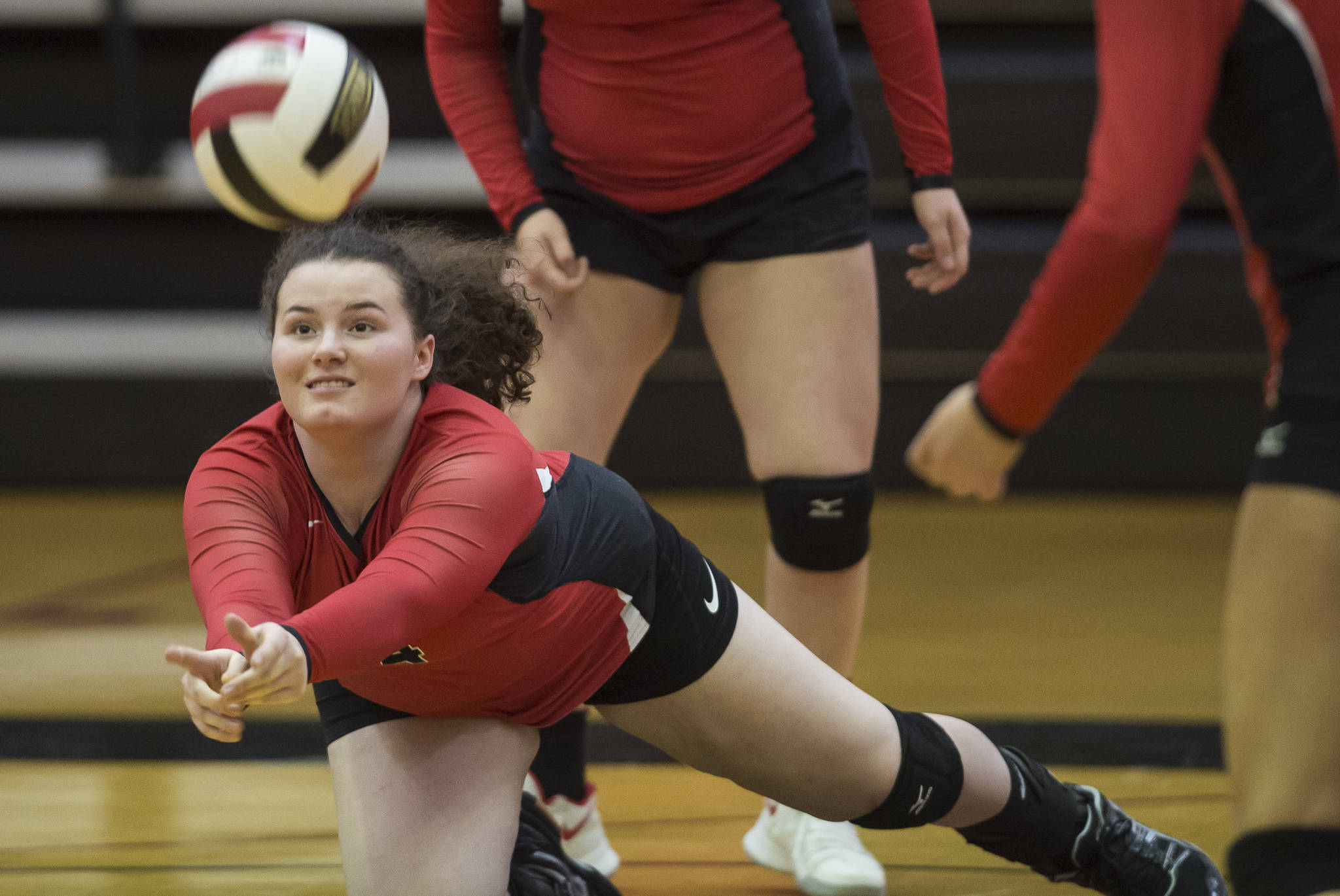 Gabi Griggs dives for the ball against Ketchikan during the JIVE Tournament at Juneau-Douglas High School on Friday, Oct. 12, 2018. (Michael Penn | Juneau Empire)