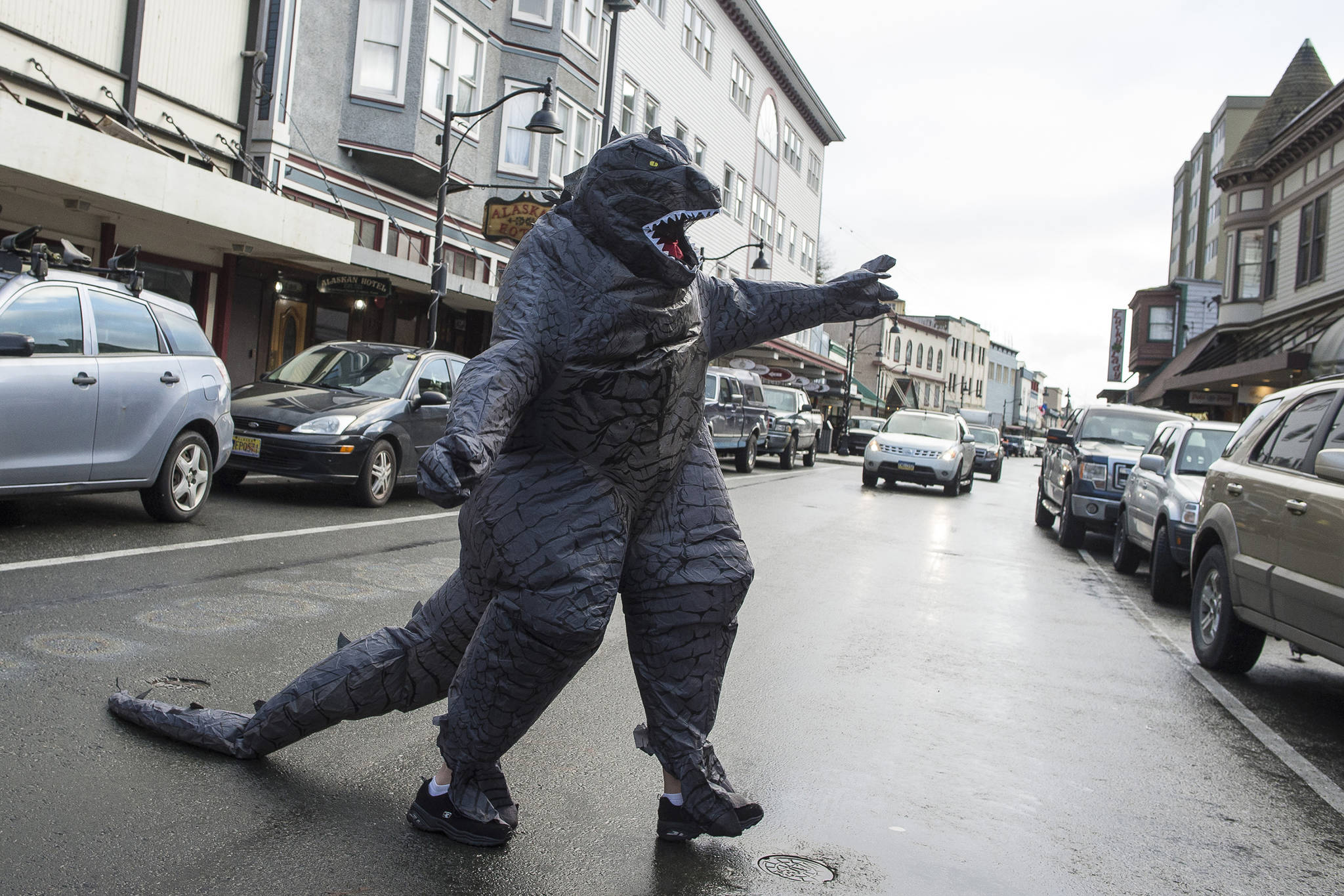 Michele Martin’s Godzilla takes command of South Franklin Street, at least for a moment, during the Downtown Business Association’s Halloween Trick-or-Treating on Tuesday, Oct. 31, 2017. (Michael Penn | Juneau Empire File)