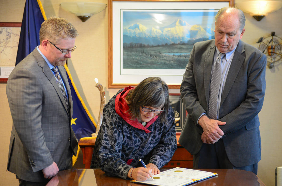 Valerie Davidson, left, takes the oath of office as Alaska’s lieutenant governor on Tuesday, Oct. 16, 2018 from Gov. Bill Walker in Anchorage. (Office of the Governor | Courtesy photo)