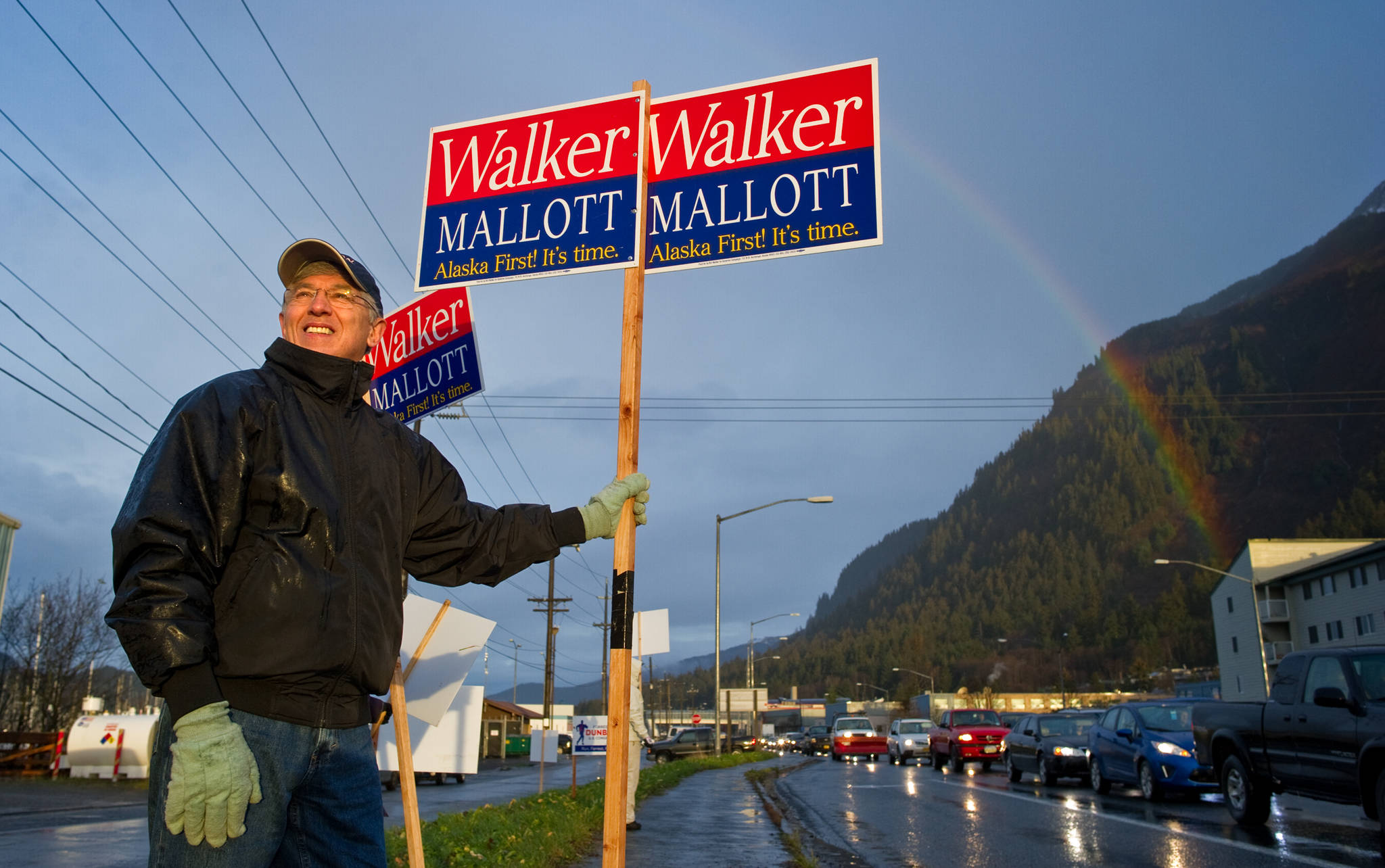 Lt. Gov. candidate Byron Mallott joins early morning sign wavers at the corner of Egan Drive and 10th Street on Monday. Mallott is running with Independent gubernatorial candidate Bill Walker.