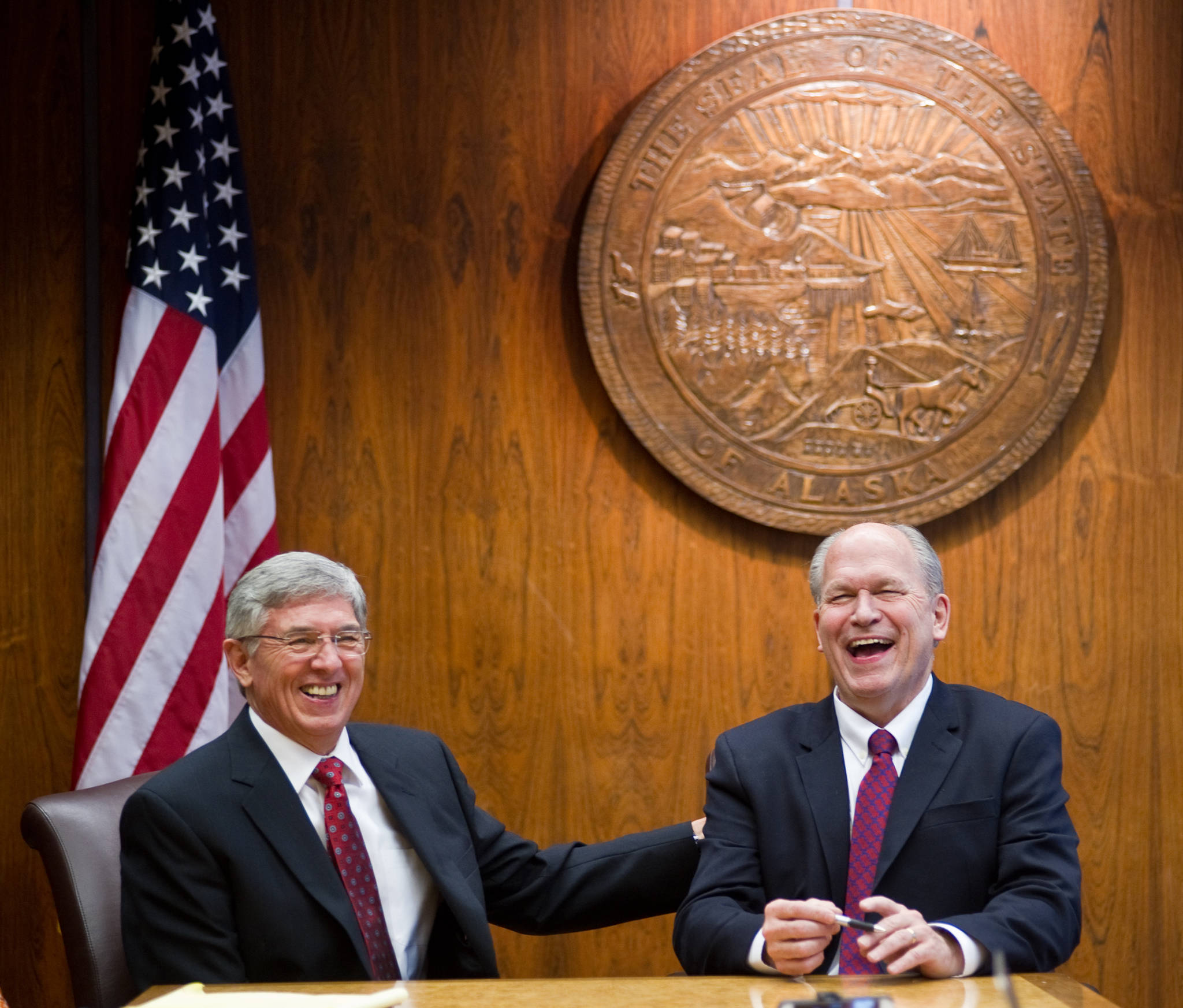 Gov. Bill Walker, right, and Lt. Gov. Byron Mallott share a light moment with reporters at the Alaska Capitol.