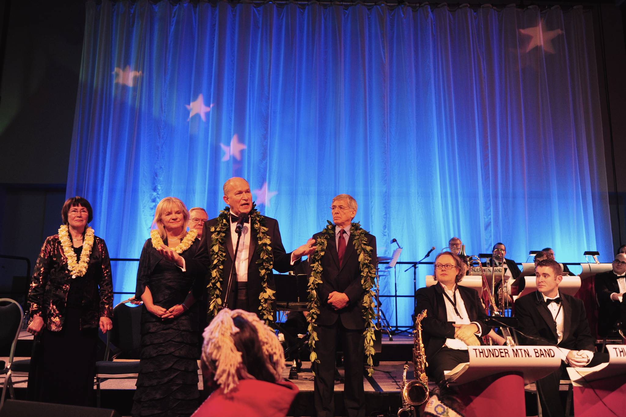 Gov. Bill Walker speaks on stage with his wife, Donna, Lt. Gov. Byron Mallott, right, and his wife, Toni, and Sen. Dennis Egan during the Inaugural Gala at Centennial Hall.