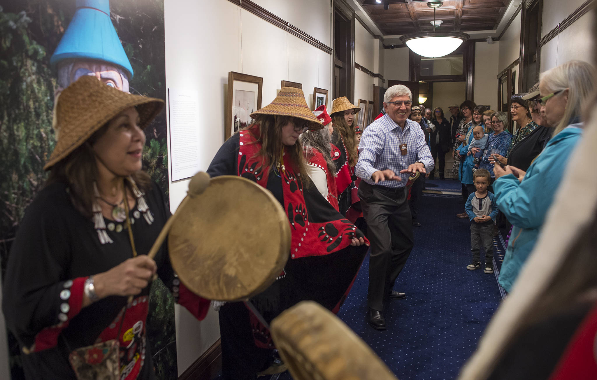Lt. Gov. Byron Mallott dances to the drumming of the Yees Ku Oo Dance Group during a First Friday event in the Lt. Governor’s Offices in the Capitol on Friday, Oct. 6, 2017. Maps, photographs, documents, and objects related to the 1867 transfer from Russia to the United States supplied by the Alaska Division of Libraries, Archives, and Museums were on display.